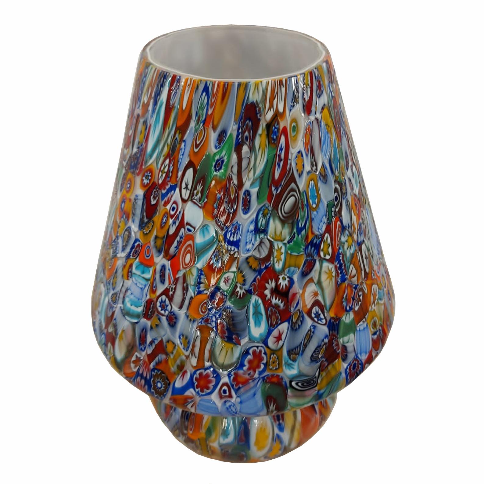 Table lamp made entirely with murrine millefiori murano glass.
Handcrafted by Murano glass master artisan. Custom made by hand and each piece differs from the other. Limited edition.
The murrina technique involves slicing canes of glass to expose