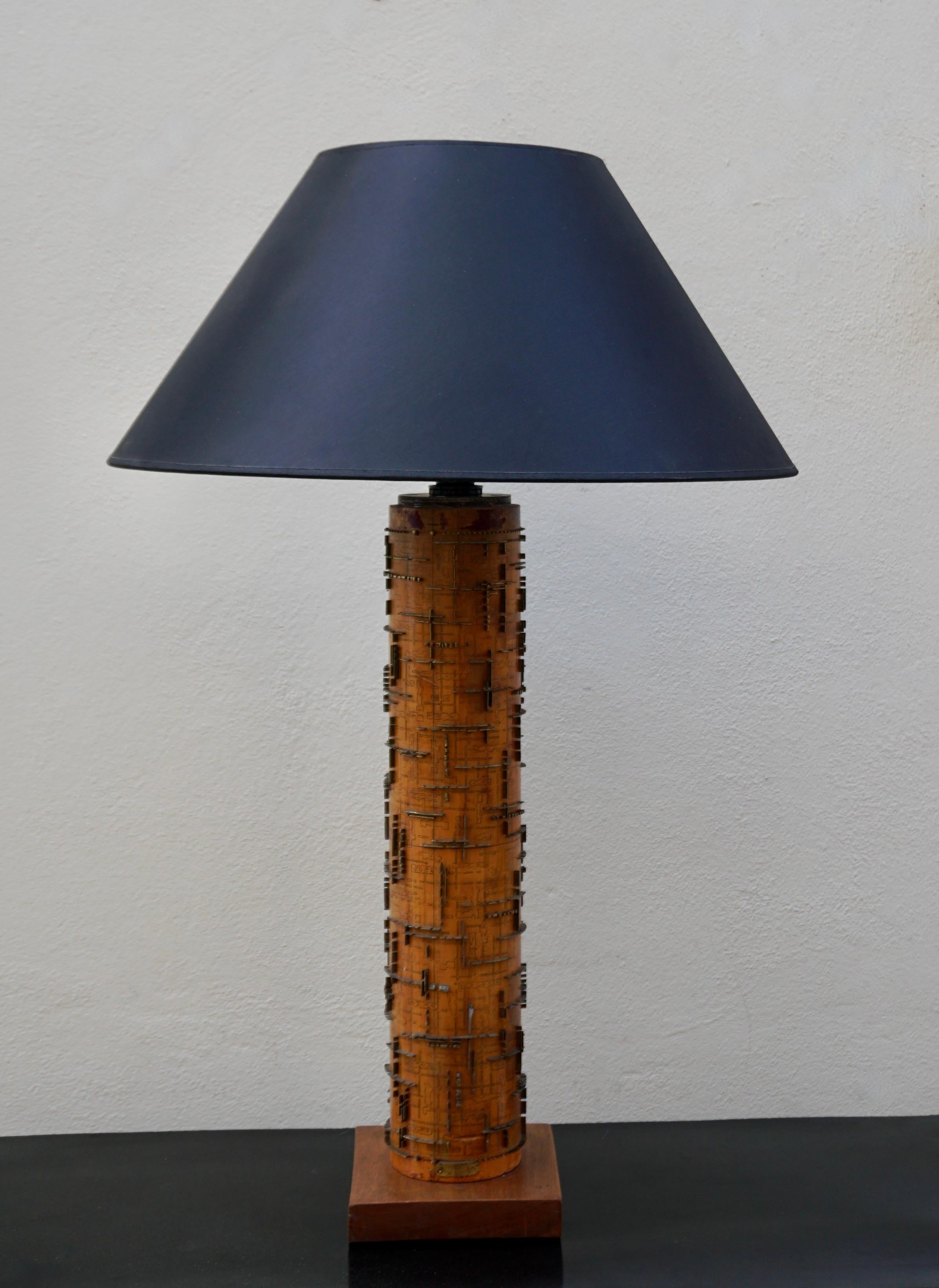 A stunning large-scale vintage wallpaper roller as lamp. Dating from the 1890s, this industrial fabric or wallpaper roller has been up cycled at some point in time into a table lamp. The roller itself is clearly identified as being made in Belgium