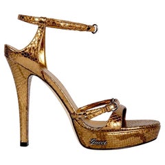 Exceptional vintage Gucci metallic gold python platform sandals 8.5