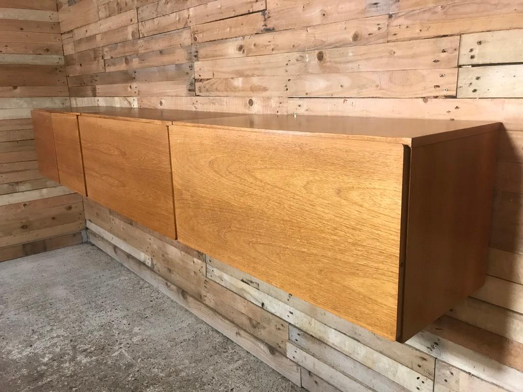 Sought after totally free-hanging XXL sideboard or desk, super minimalistic. Height can be adjusted as required, it is very easy to fix to the wall (with metal wall brackets which are all included!). This set comes in three parts, each cupboard has