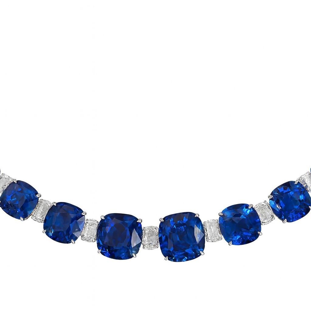 Exceptional Vivid Blue Sapphire and Diamond Necklace
This breathtaking necklace showcases a graduating series of 31 cushion-cut vivid blue sapphires, each of exceptional saturation and clarity, with an estimated total sapphire weight of