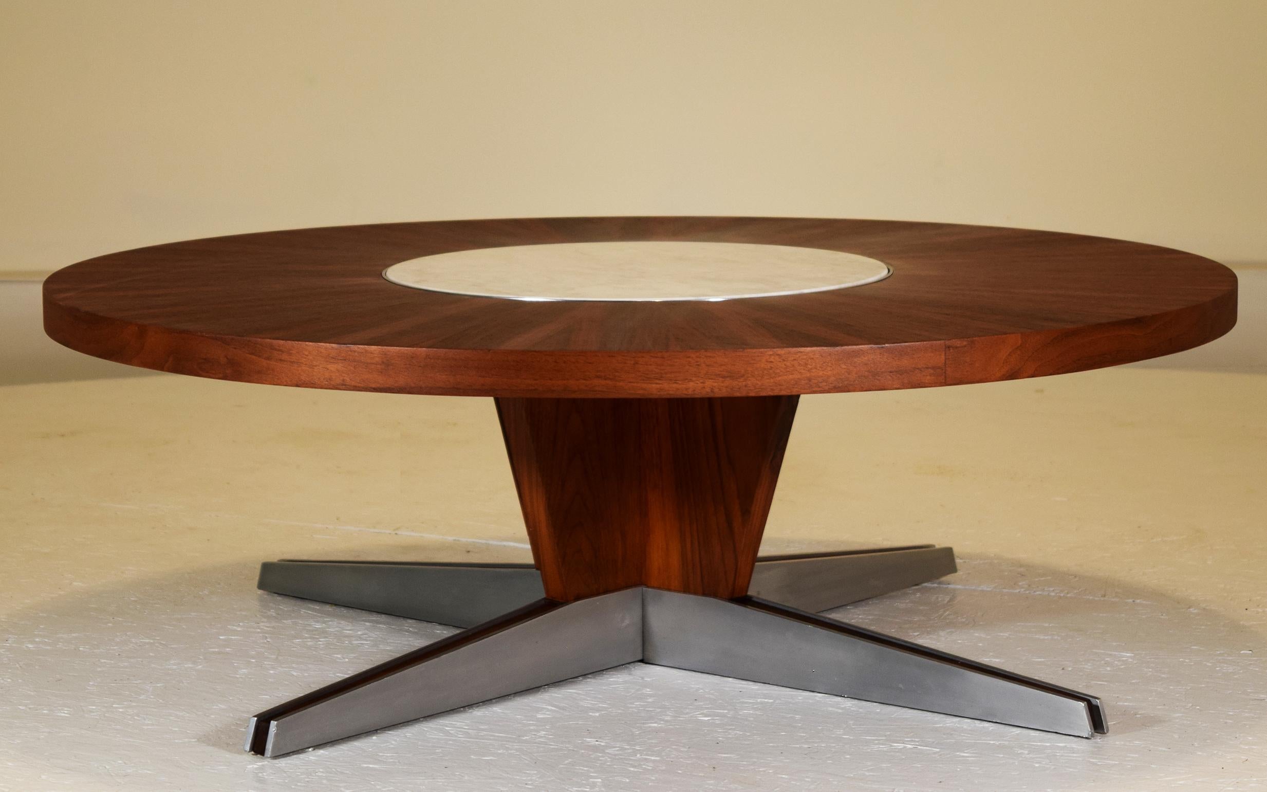 Vladimir Kagan Dreyfuss, NY, 1955
Black American walnut, marble, polished aluminum. Measures: 42 inch diameter x 14.5 inches tall.
Outstanding condition.
A rare circular cocktail table by Vladimir Kagan with polished aluminum blades with walnut