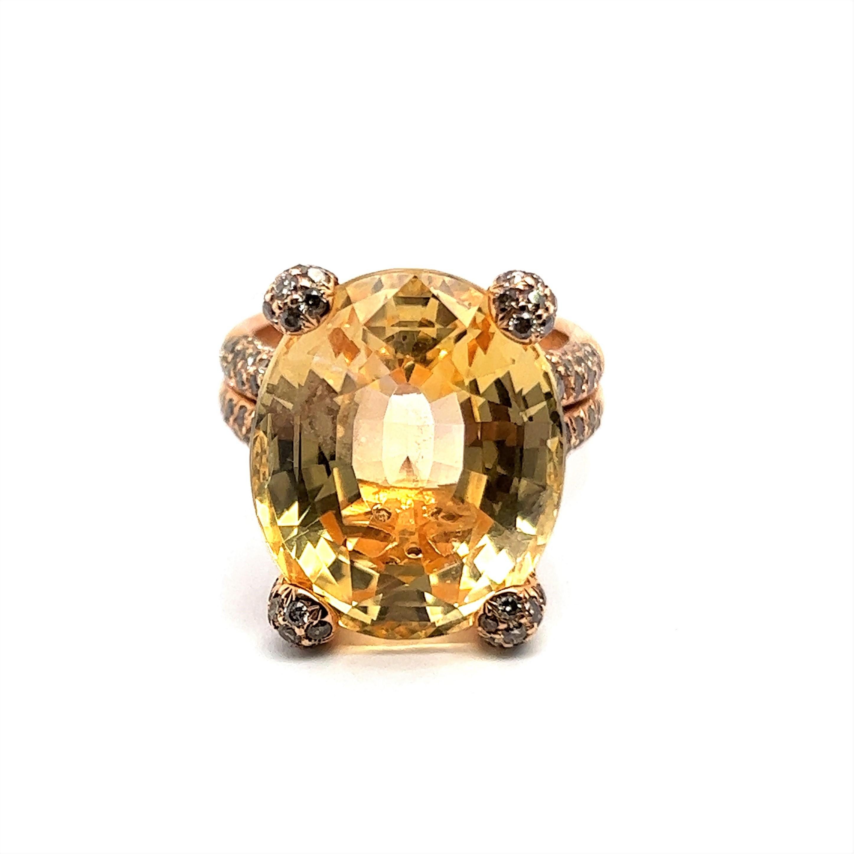 An exceptional yellow sapphire and diamond ring, striking in its majesty. 

The entire composition is designed in 18 Karat yellow gold and is a symphony of colour and joy. Its crowning piece is an impressive oval-cut yellow sapphire of 24.47 carats.
