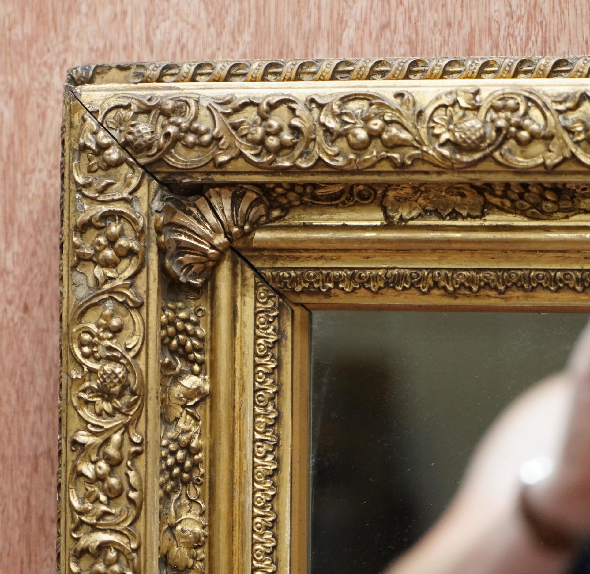 Hand-Crafted Exceptionally Carved and Heavily Detailed Period Victorian Wall Giltwood Mirror For Sale