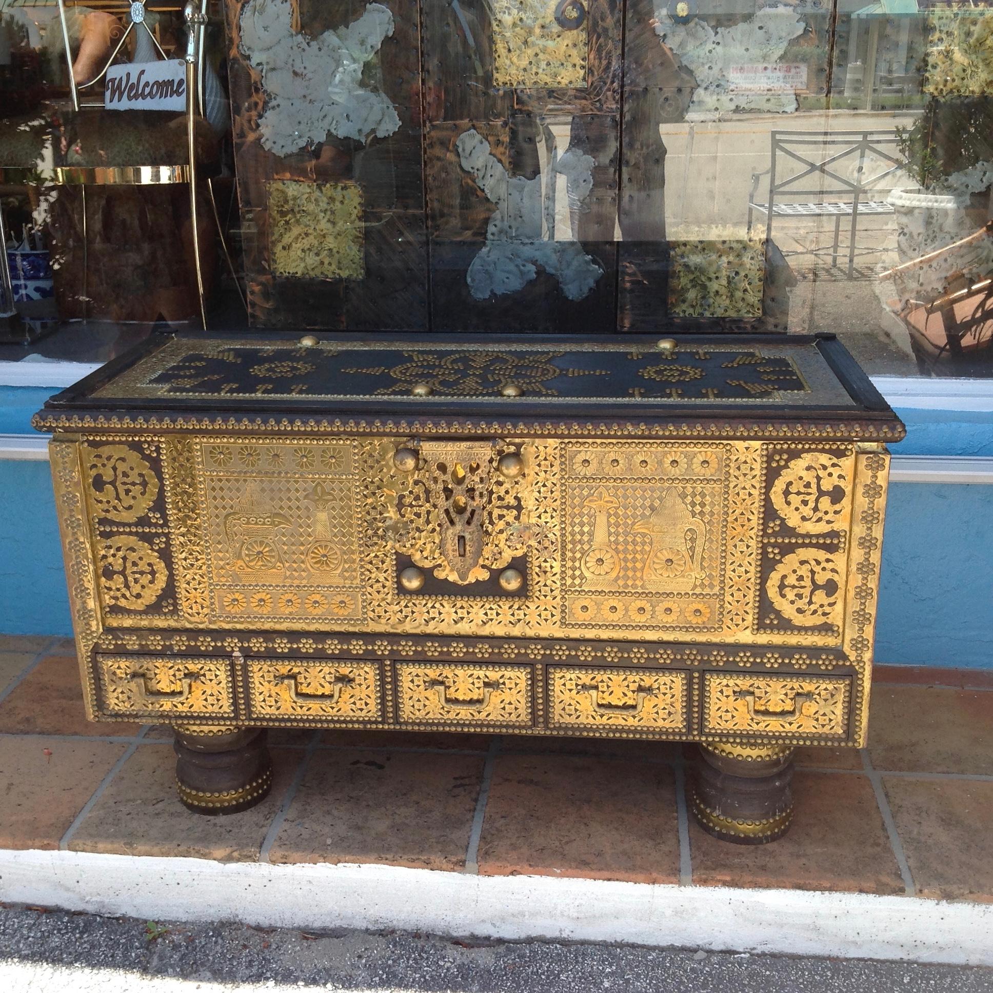 Ideally scaled as a coffee table with extensive brass overlays
The piece is designed with five bottom drawers.
The 