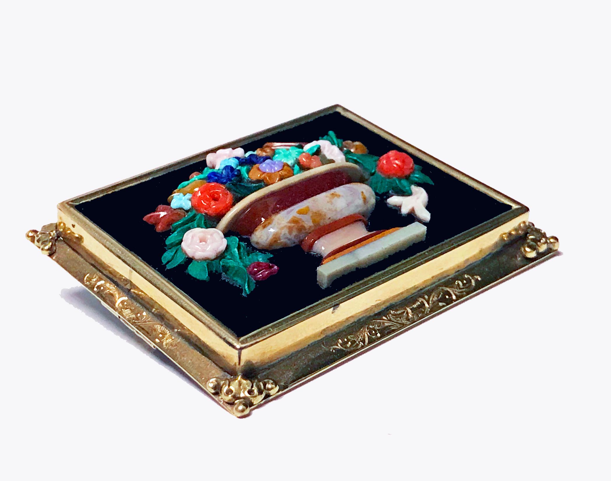 Exceptionally fine bouquet of flowers Brooch Pin, carved chalcedony on basalt within gold frame (tests as 15K), 19th century. The rectangular plaque form Brooch with multi colour carved chalcedony agates depicting an urn shaped vase of flowers