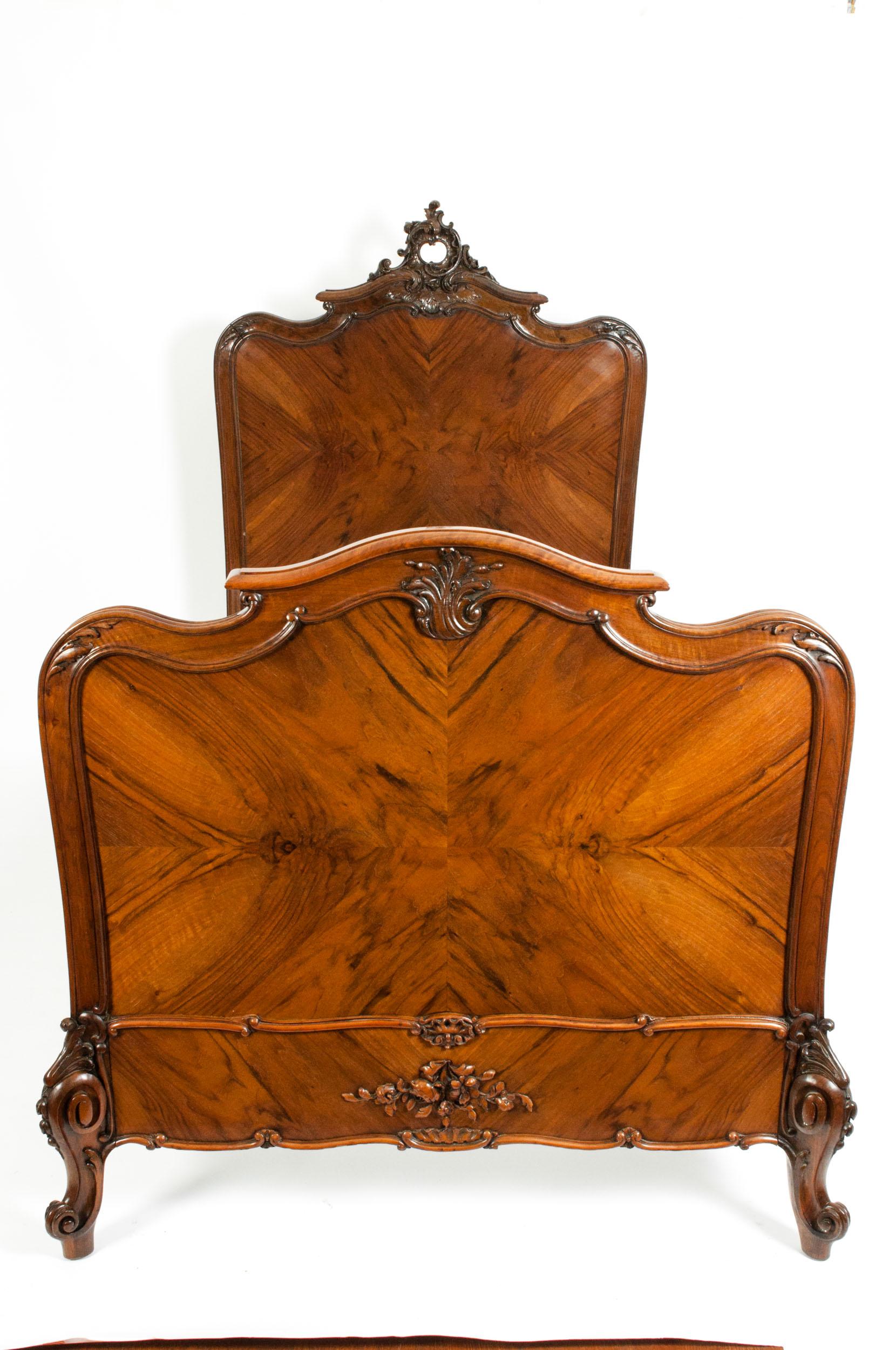 Superior craftsmanship and elegant adornment characterize these exceptional, exceptionally hand carved matching pair of mahogany single beds with superb craftsmanship design details. Each bed is in great antique condition with appropriate wear