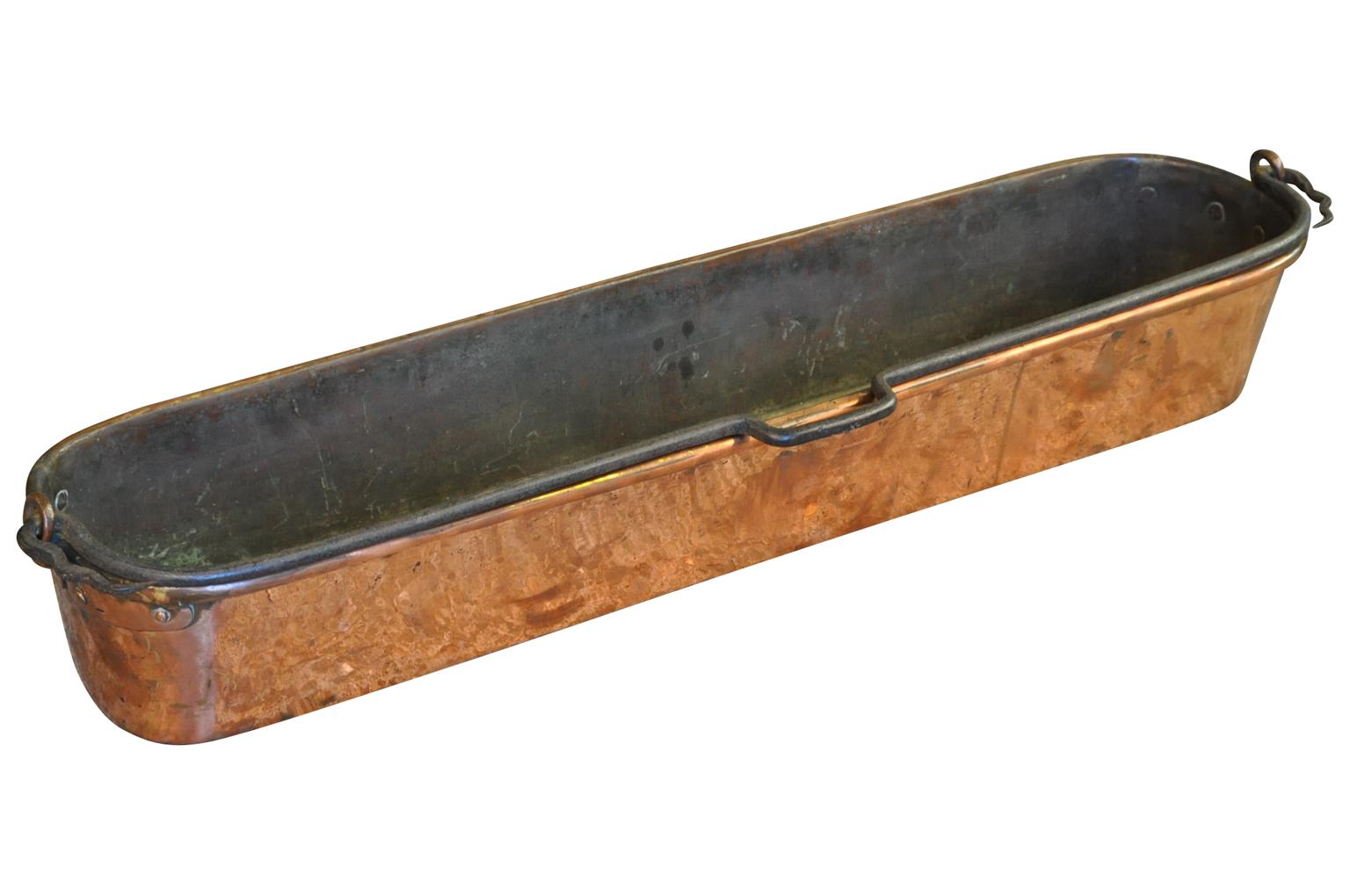 An exceptionally large 18th century fish pan in copper from the South of France. A perfect farm table center piece.