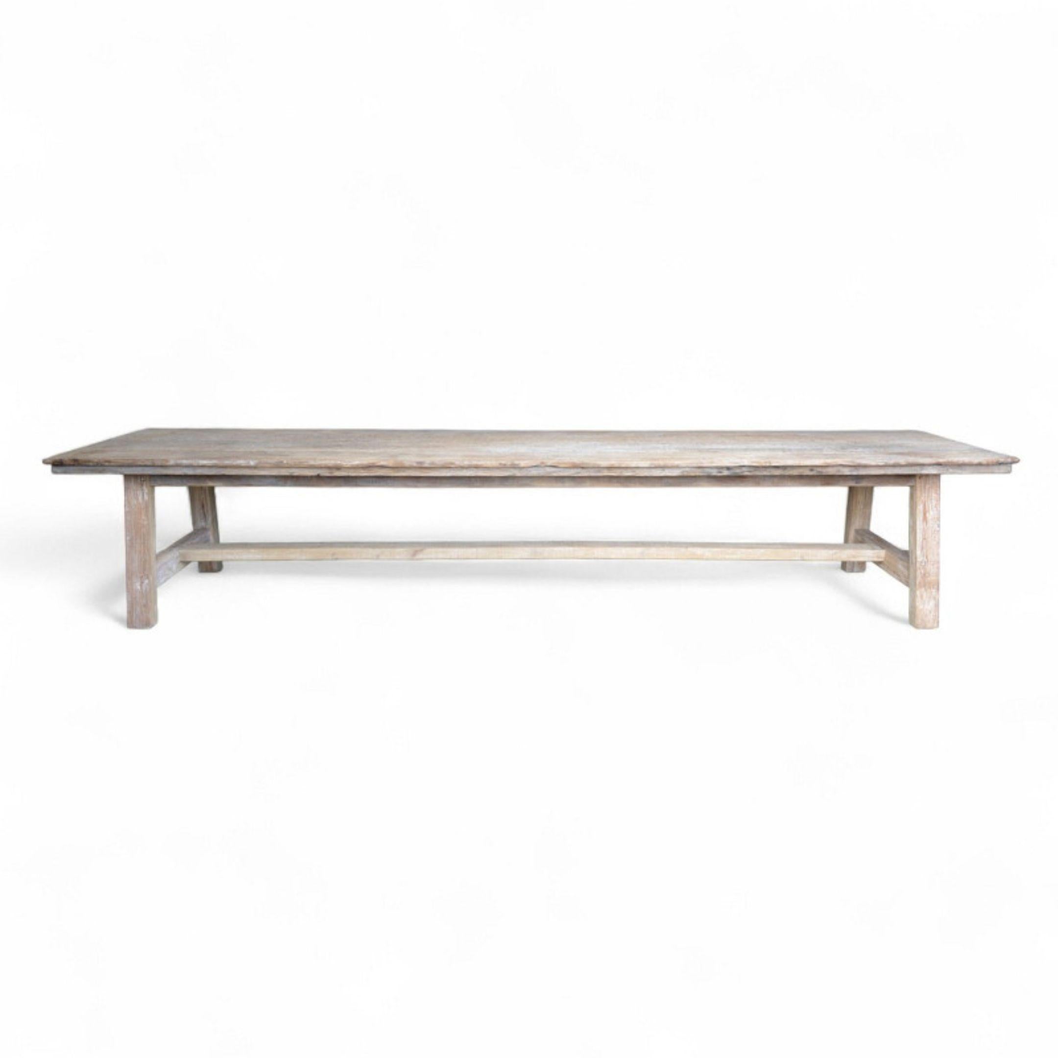 Crafted from reclaimed Bangkirai, a dense tropical hardwood known for its rich grain and resilience, this extraordinary dining table spans over four meters in length. Its monumental scale and solid plank construction make it a striking centrepiece