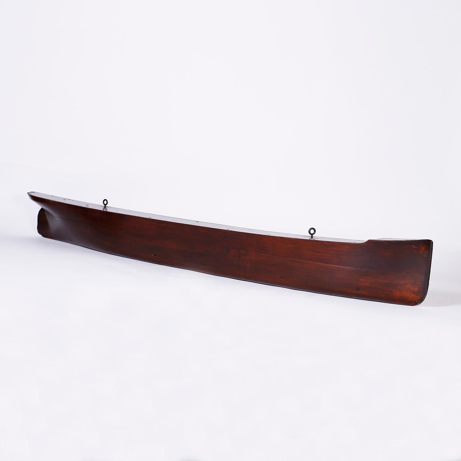 Super large antique English half hull model of a sailing ship crafted in indigenous hardwood with a graceful sea going form and plenty of decorative appeal.