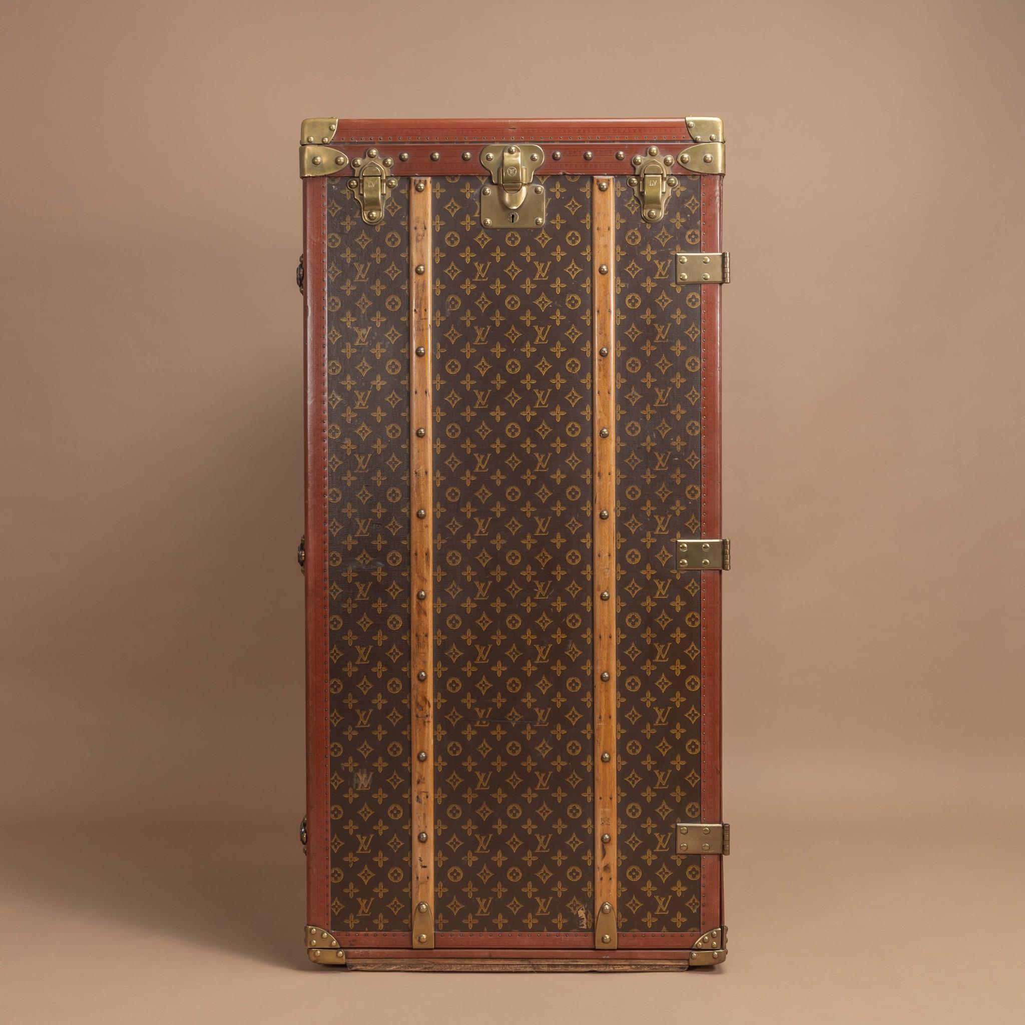 A rare, very large scale brass bound Louis Vuitton wardrobe trunk in LV Monogram with lozine trim and original interior fittings providing hanging space; circa 1955. Has the original owner's name and details. Marian Carter-Achilles was wife to