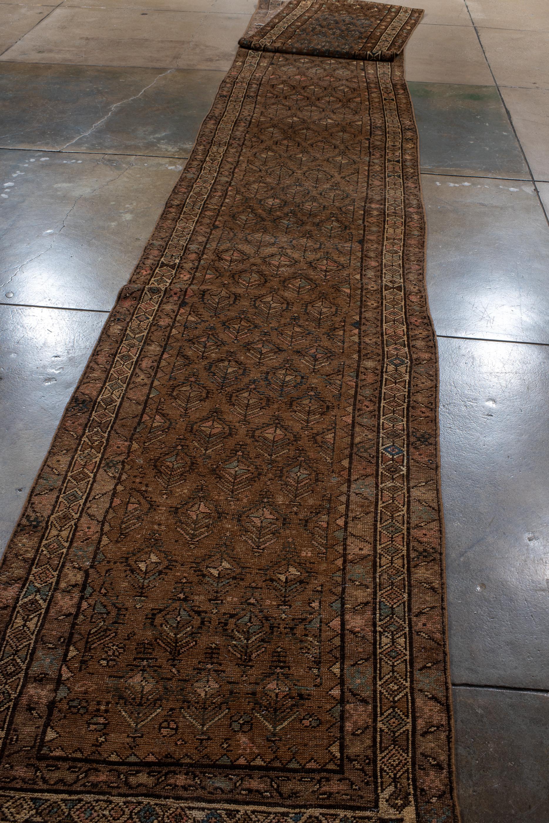 Persian Exceptionally Long Kurdish Runner with Red Field and Blue Toned Flowers For Sale