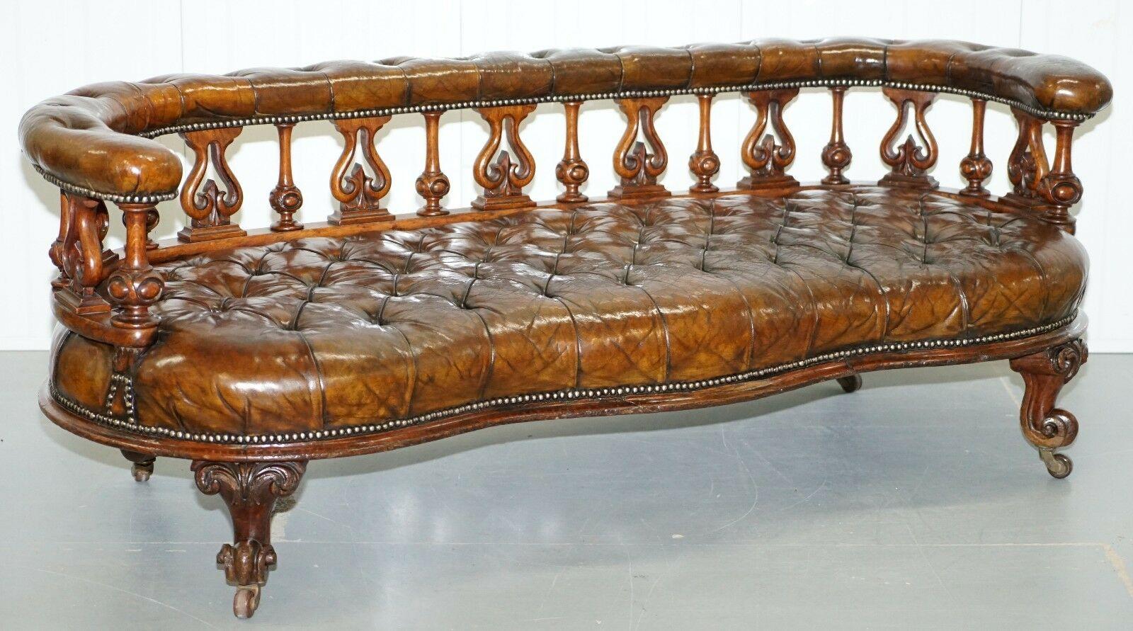 We are delighted to offer for sale this stunning hand made in England Circa 1840 Victorian fully restored Chesterfield Whiskey brown leather salon sofa or bench

This piece is just about as sculptural a sofa as you will every find, the front line