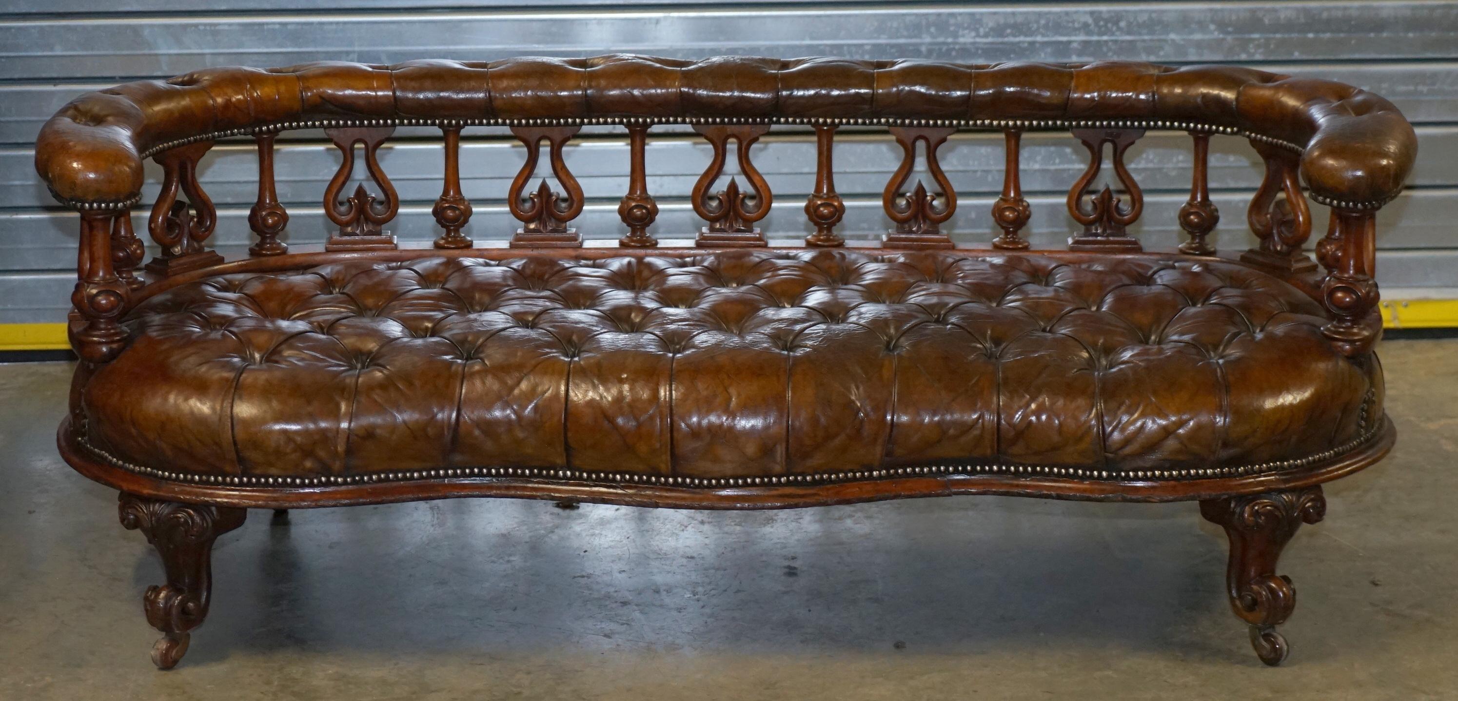We are delighted to offer for sale this stunning handmade in England circa 1840 Victorian fully restored Chesterfield Whiskey brown leather salon sofa bench

This piece is just about as sculptural a sofa as you will ever find, the front line is