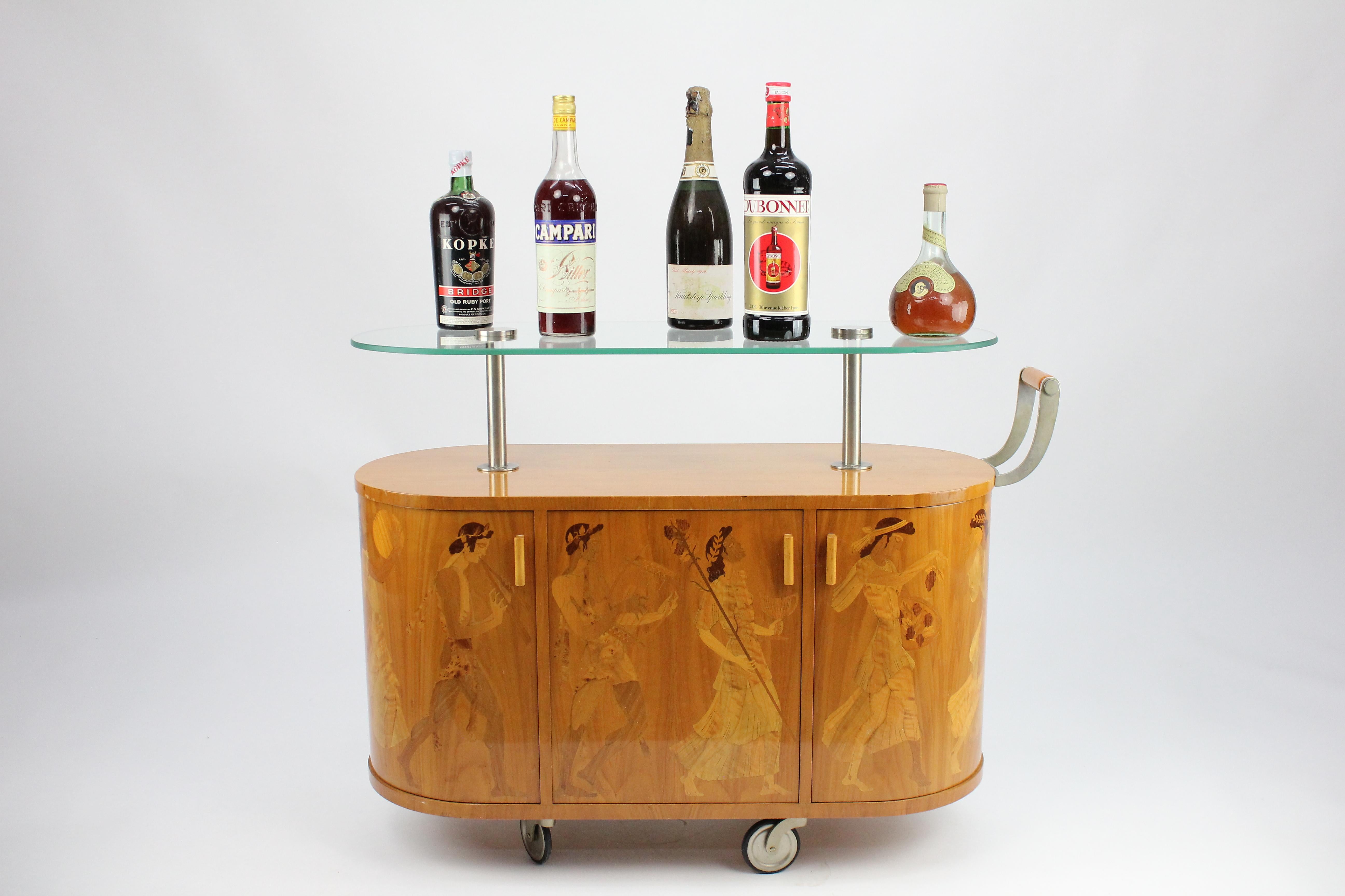 Exceptionell Art Deco bar wagon by Erik Mattsson 1939 for Mjölby Intarsia, Sweden.

The bar wagon or bar cart was named 