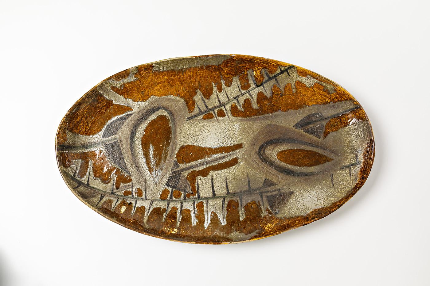 An exceptional ceramic dish by Atelier Madoura to Vallauris, France (style of Picasso).
Perfect conditions.
circa 1960-1970.
Unique piece.
Signed under the piece 