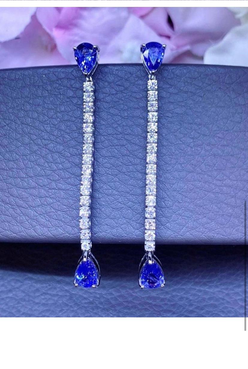 So chic and elegant design by Italian designer. 18k gold tennis earrings with four pieces of Ceylon sapphires in pear cut of 4,29 carats,fine quality, and round brilliant cut diamonds of 1,45 carats F/VS.
Handcrafted by artisan goldsmith.
Excellent