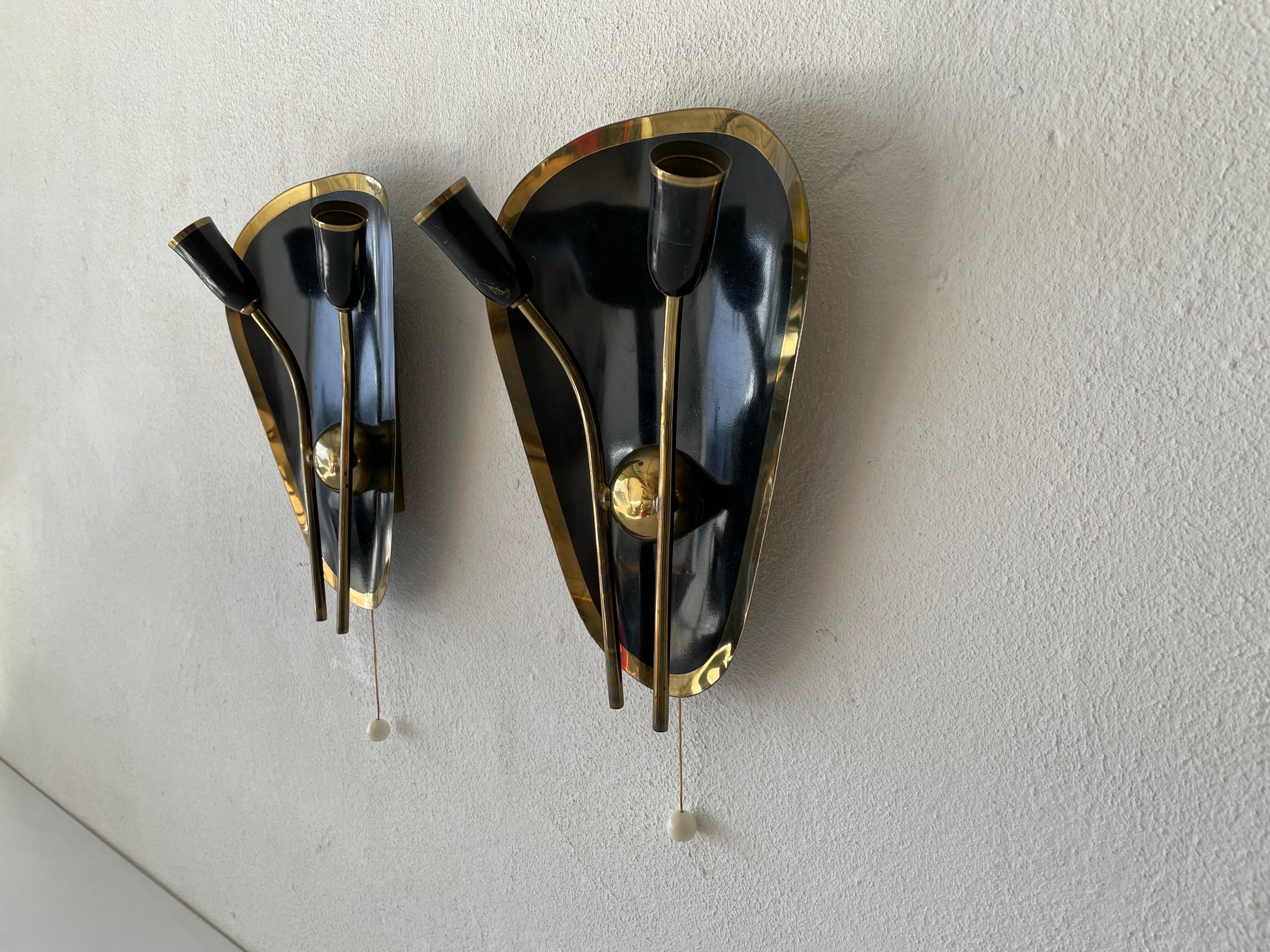 Exclusive Atomic Design Brass - black metal pair of sconces, 1950s, Germany

Very elegant and Minimalist wall lamps
Lamp is in very good condition.

These lamps works with E14 standard light bulbs. 
Wired and suitable to use in all countries.
