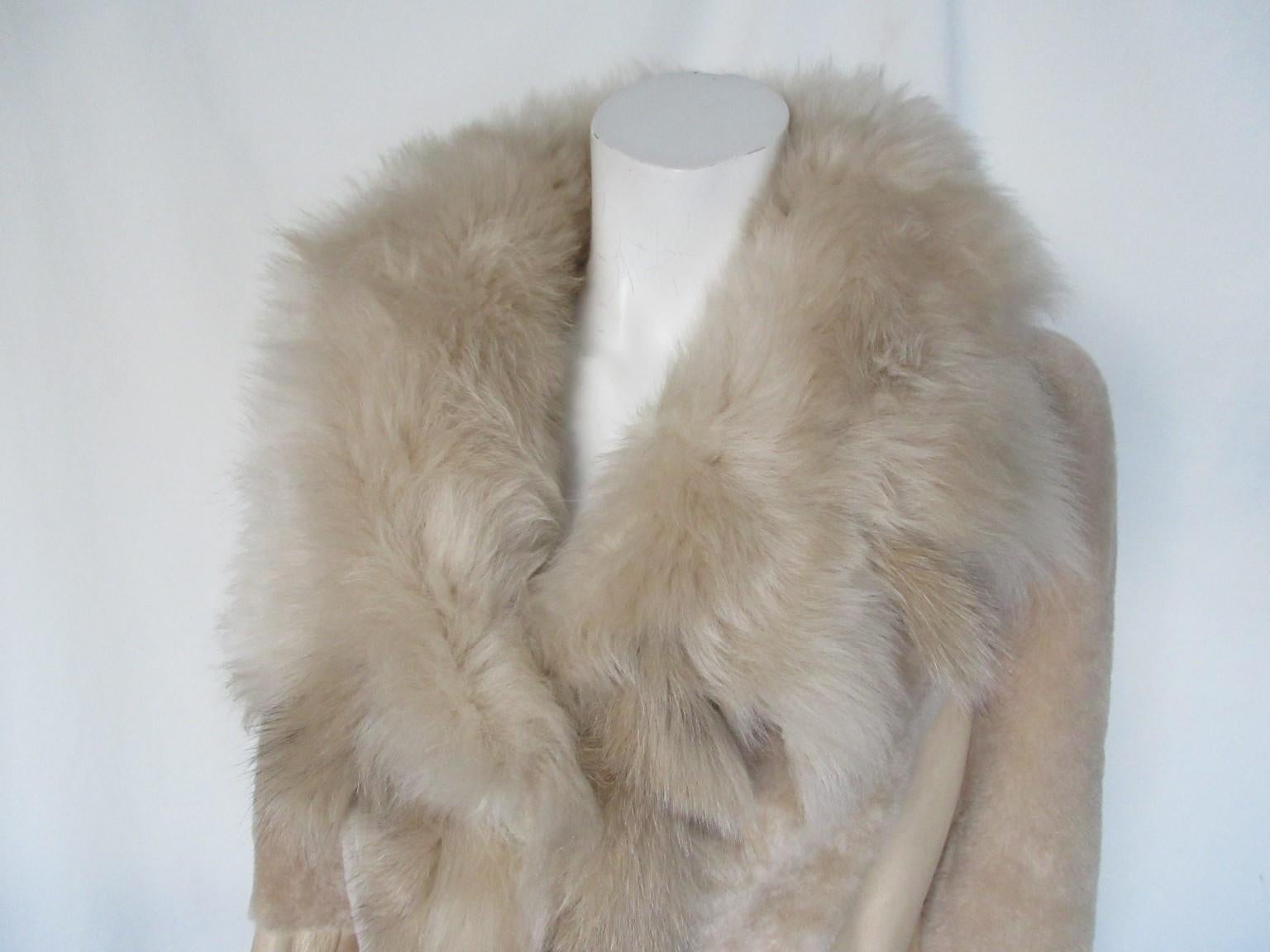 Super soft quality suede/leather tuscany lamb long coat 

We offer more exclusive fur items, view our frontstore

Details:
Mix & match leather/ shearling/mouton retournee
Color of leather is shiny pearl tone
With 2 pockets and 4 closing