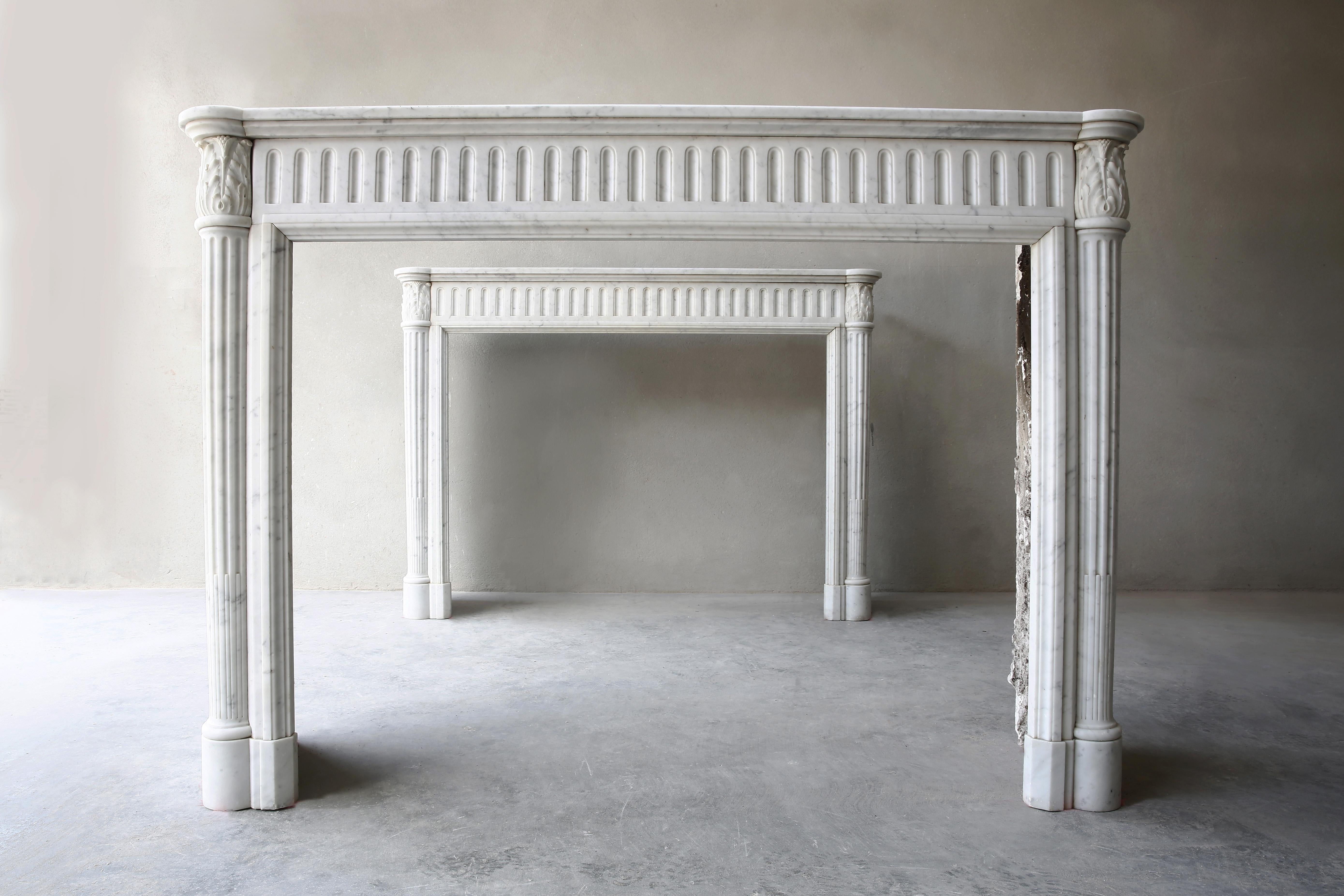 A unique couple of identical antique Carrara marble fireplaces ! 
These two mantel pieces are from Paris - France.
Provenance is about 1860-1890 and are in style of Louis XVI. 
These special fireplaces are available per couple.