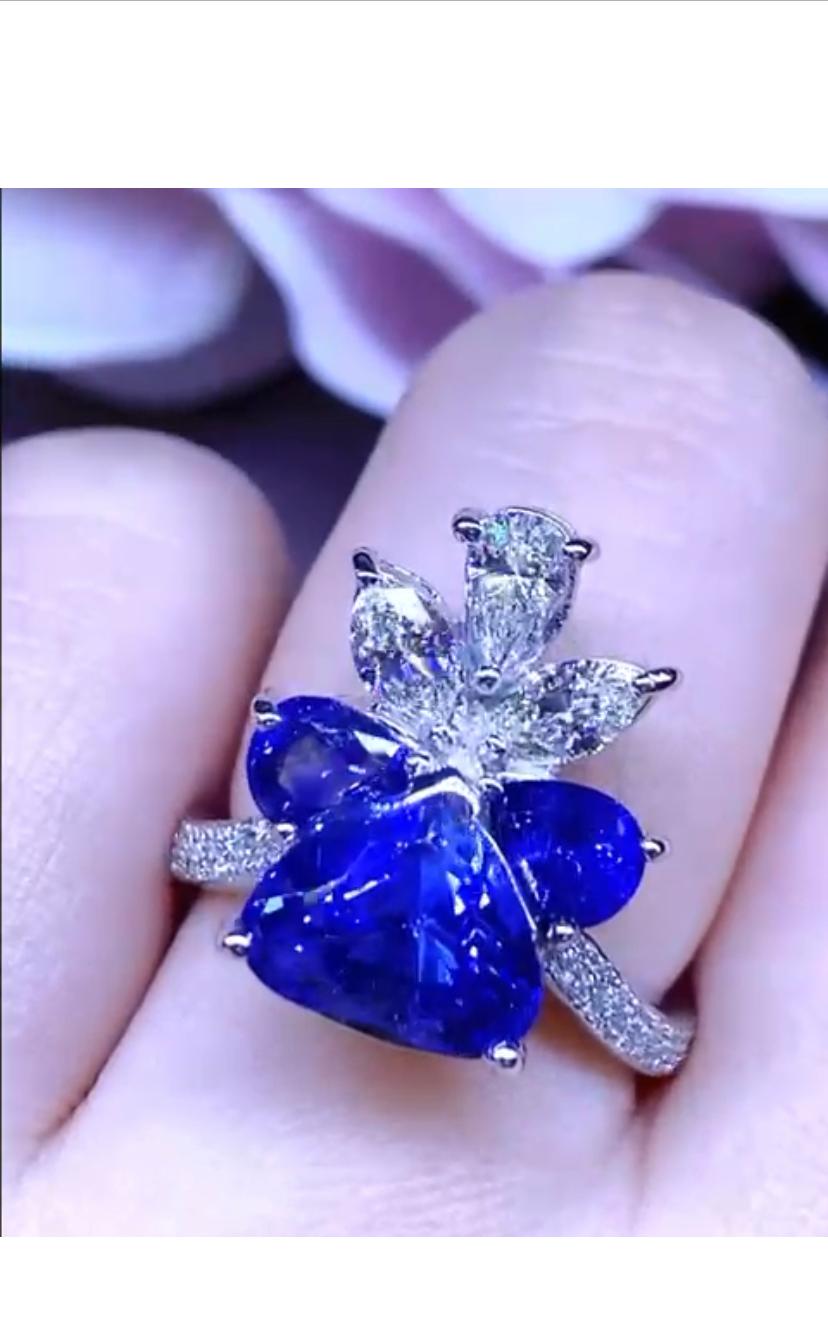 Magnificent design in 18k gold with heart cut vivid Ceylon sapphire, excellent quality for color and clarity, ct 4,19 , and pear cut vivid Ceylon sapphires ct 1,42 and diamonds special cut and round brilliant cut ct 0,93 F/VS.
Handmade by artisan