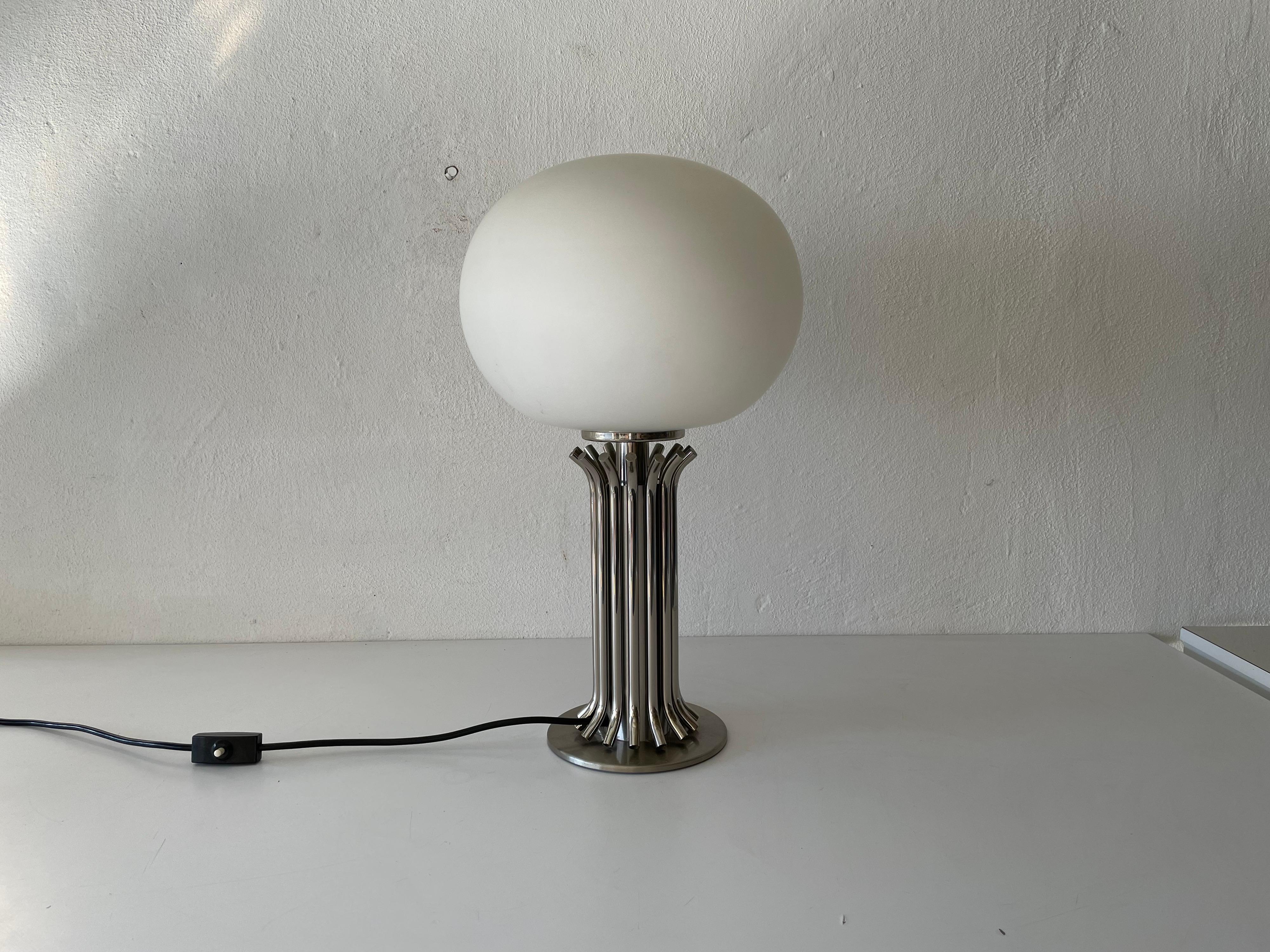 Exclusive Italian design chrome and opal glass table lamp, 1970s, Italy

Lampshade is in very good vintage condition.

This lamp works with E27 light bulb. 
Wired and suitable to use with 220V and 110V for all