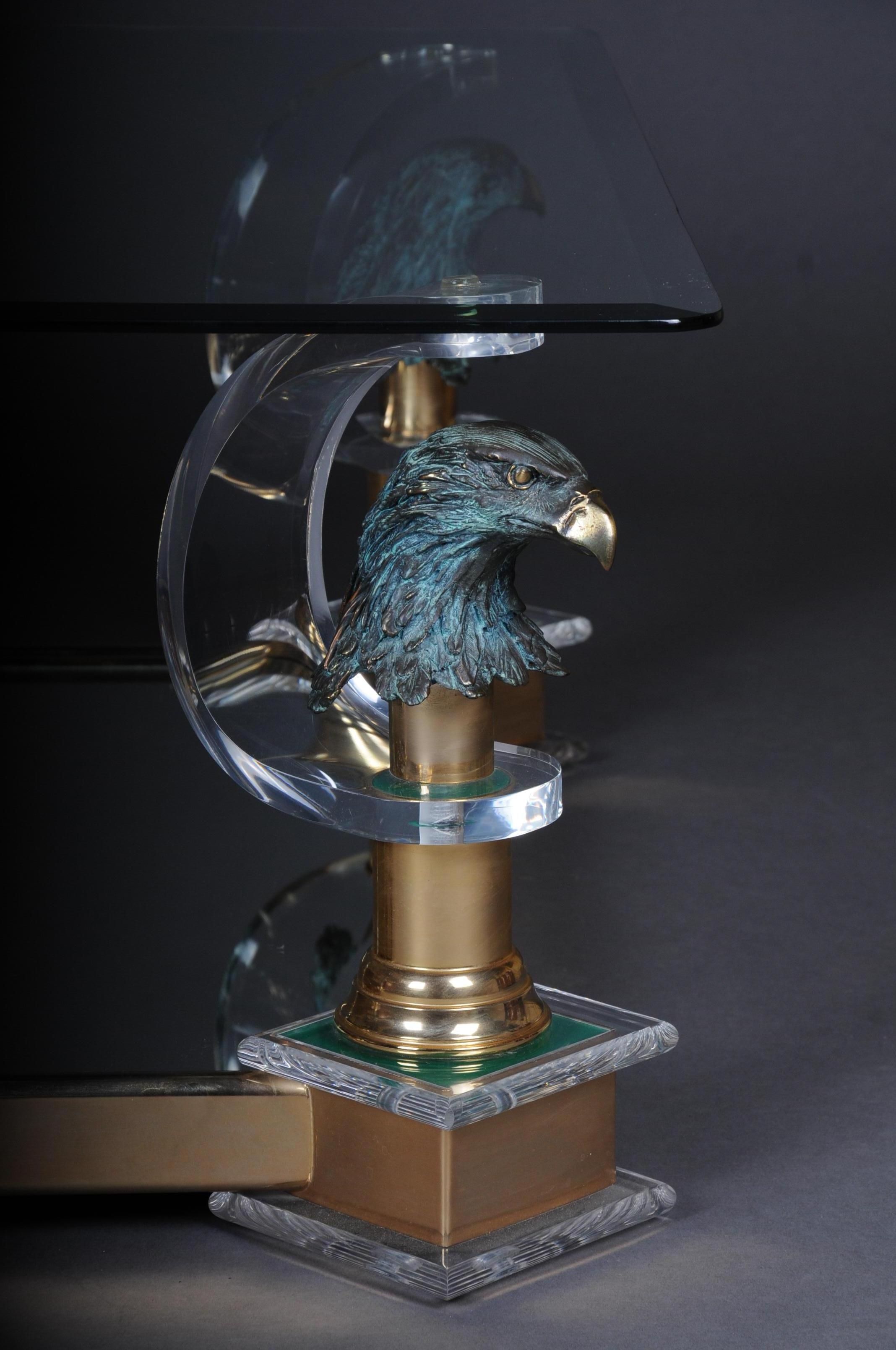 High quality designer coffee table made of high quality acrylic and eagle heads by Maison Charles.
Mirrored table bottom. Faceted glass plate. High quality processed eagle heads on each column shaft.
Very decorative and an absolute highlight in