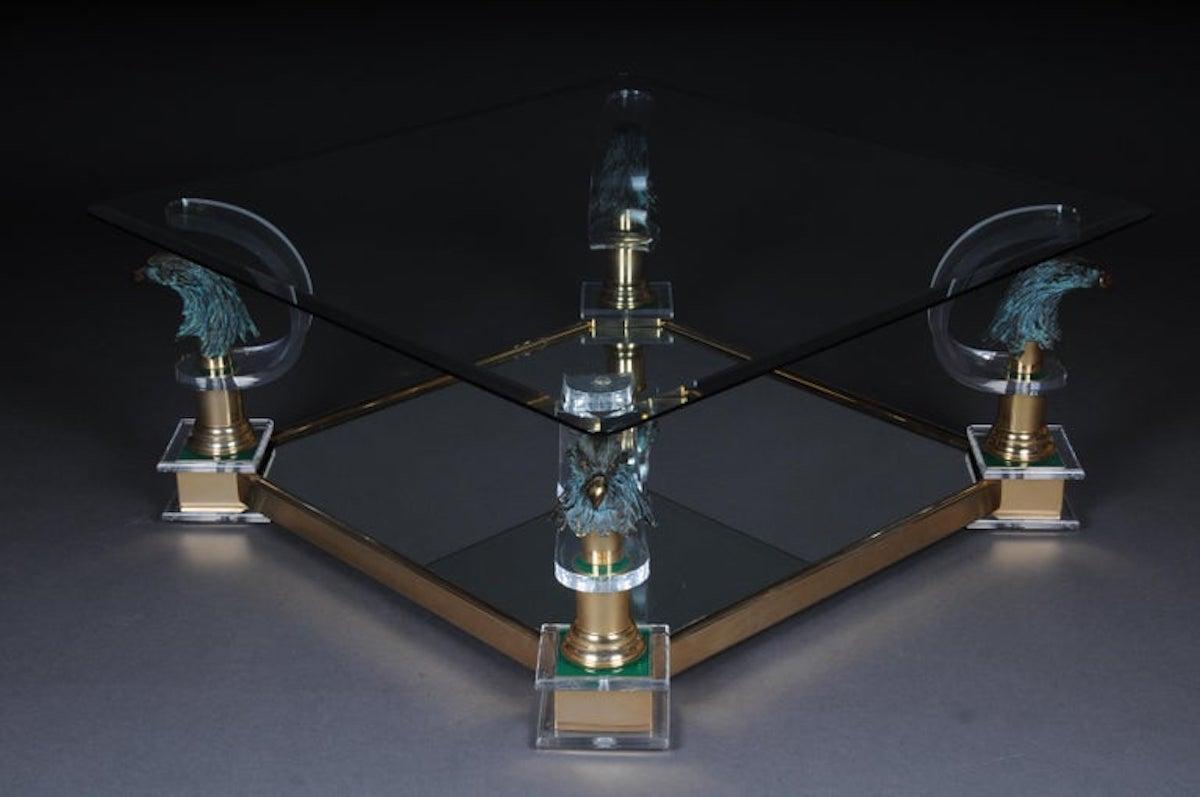 High quality designer coffee table made of high quality acrylic and eagle heads by Maison Charles.
Mirrored table bottom. Faceted glass plate. High quality processed eagle heads on each column shaft.
Very decorative and an absolute highlight in
