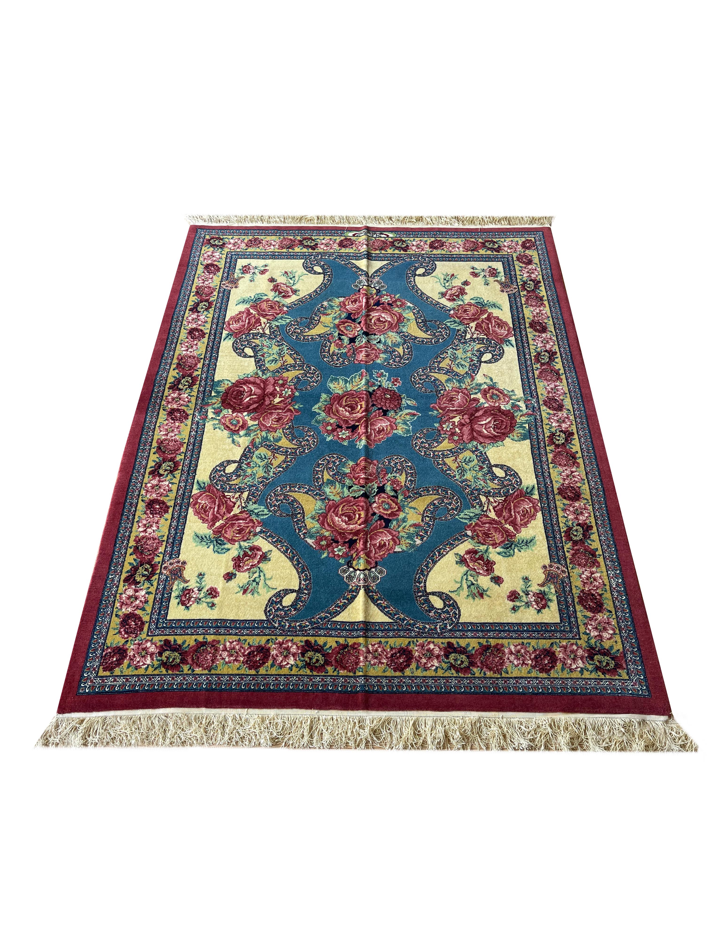 Exclusive handmade rug made of high-quality materials and designed from a very high-end rug workshop.
The background of this floral rug shows this blue rug as very vivid and shiny. 
The design of this rug includes naturally patterned roses in the