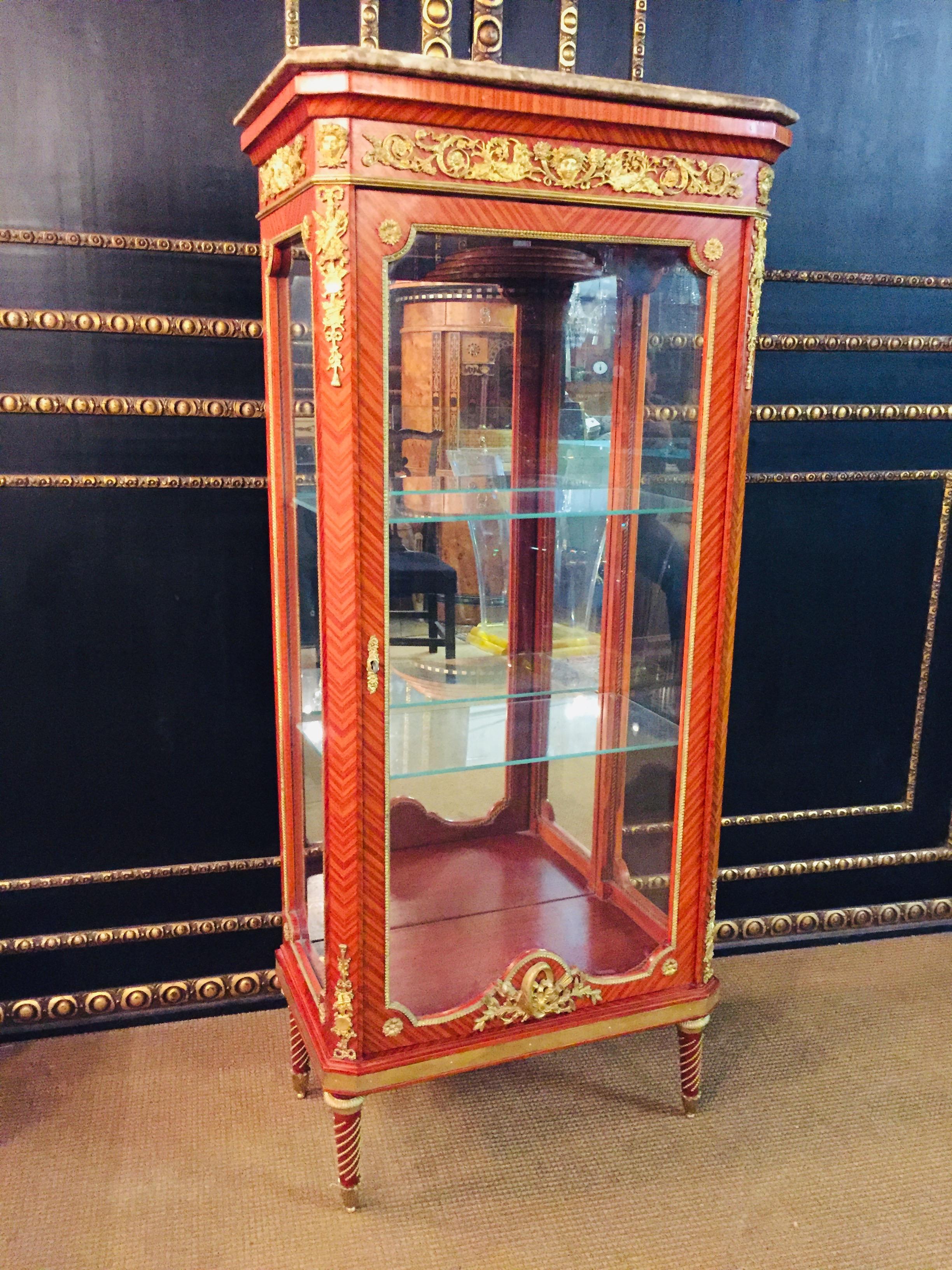 Only this Week Special Price 

Finely engraved and moulded bronze. Solid beechwood. Three sided glassed, one-drawered body on conical legs. Profile framed flecked Marble platter. On the front, corners and sides, classicist figuring’s.