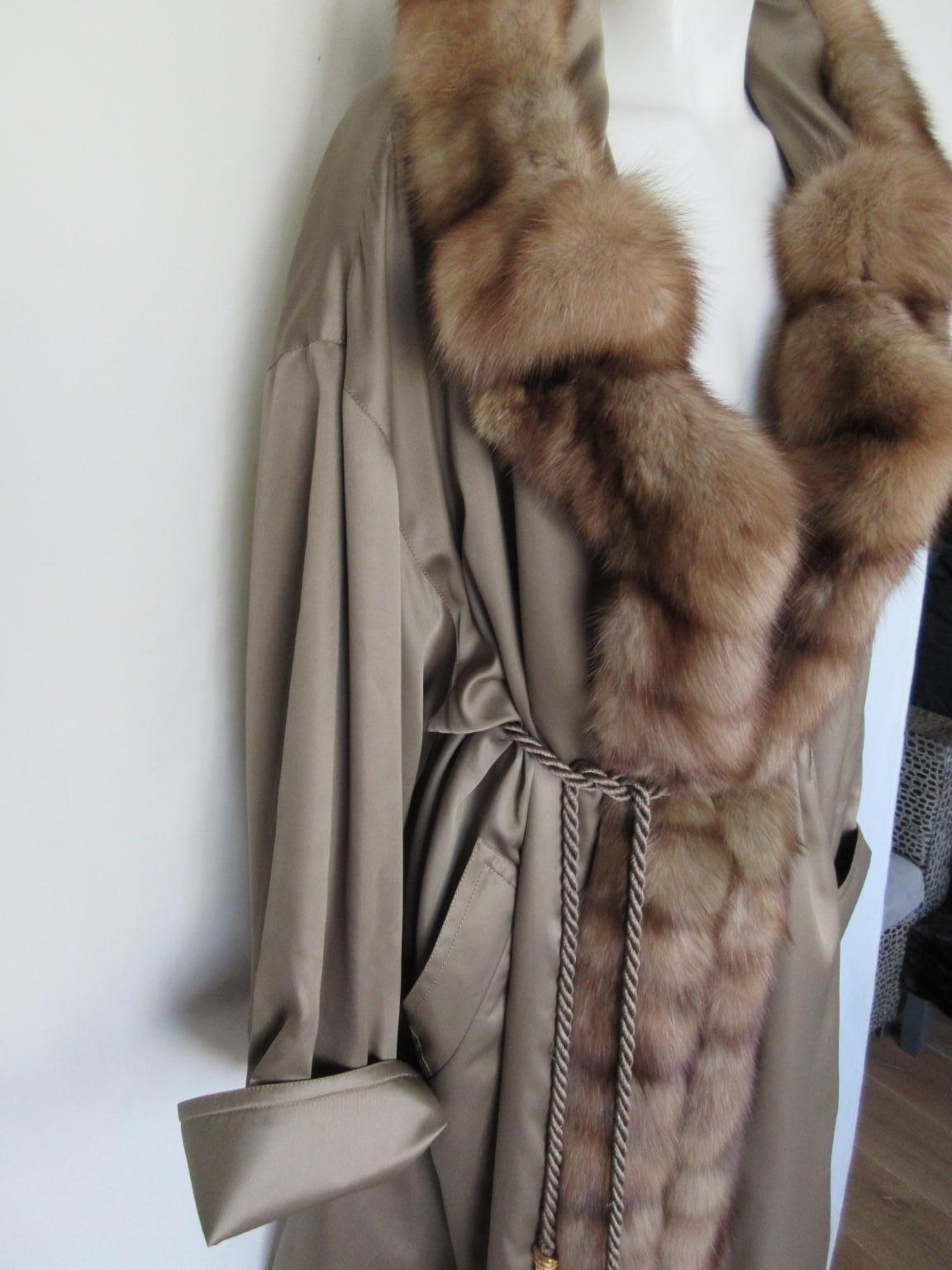 Rare Christian Dior Paris vintage coat with golden sable fur 
Collectors item

We offer more exclusive fur items, view our frontstore.

Details:
Trimmed with quality soft golden sable fur
and made from greenish shiny satin fabric
Its easy and light