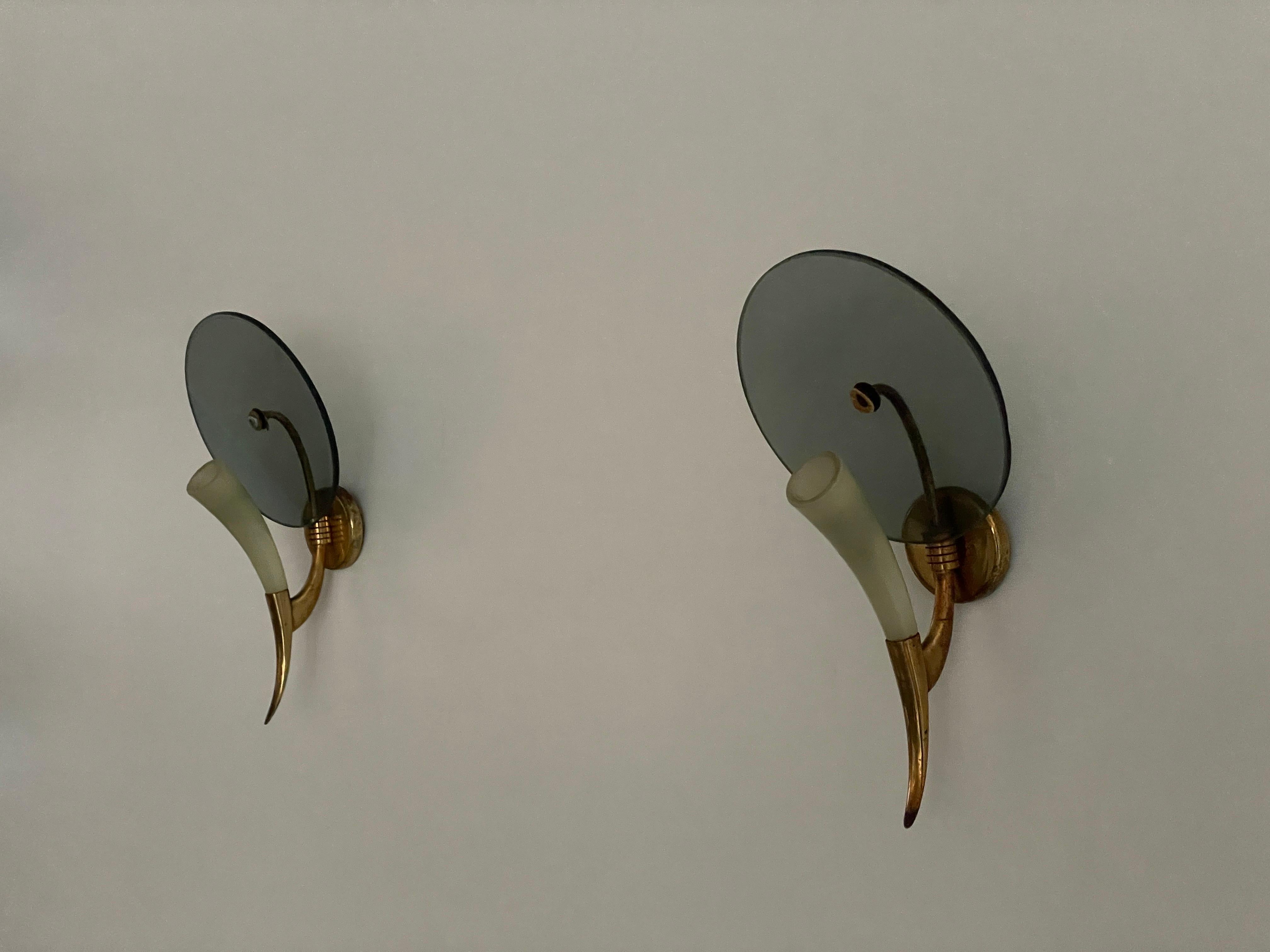 Exclusive Horn-shaped Glass and Brass Pair of Sconces, 1940s, Italy

Lamps are in very good vintage condition.

This lamp works with E14 light bulbs. 
Wired and suitable to use with 220V and 110V for all countries.

Measurements:
Height: 28
