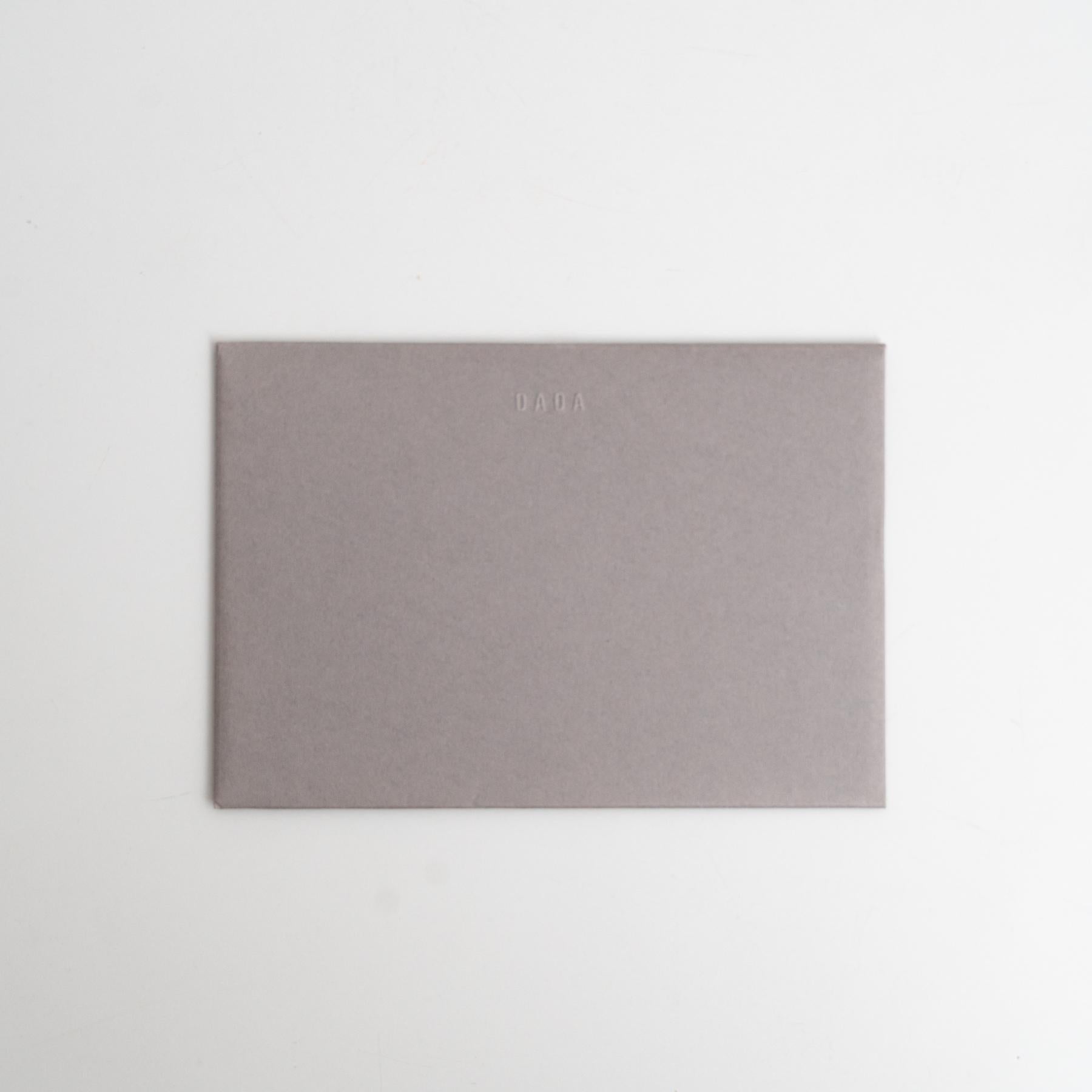 Own a rare piece of art history with this exclusive invitation card from Enrico Della Torre's 2016 exhibition at our DADA Gallery. This high-quality, thick cardboard invitation has been artistically intervened and hand-signed by Della Torre, making