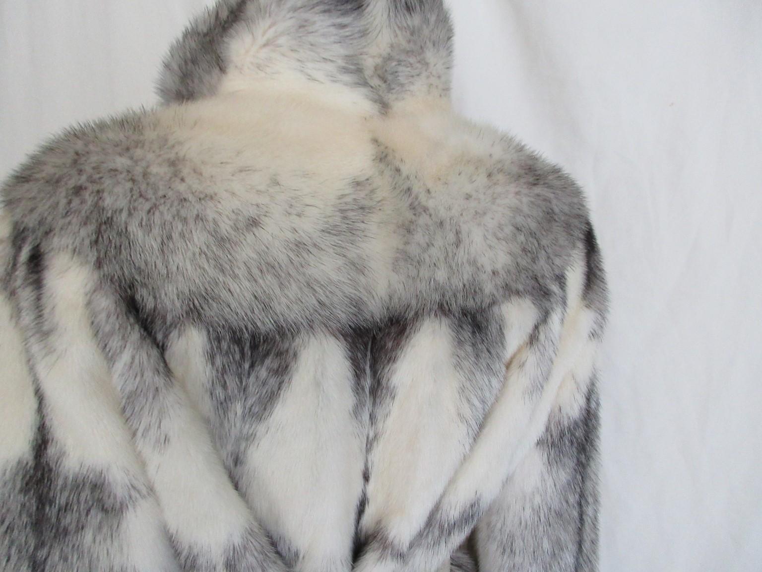 This vintage coat is made of rare kohinoor/cross mink fur with a beautiful black lining

View our storefront for more mink fur coats and other vintage items.

Details:
With 2 pockets and 3 closing hooks and a collar hook
narrow sleeves ends against