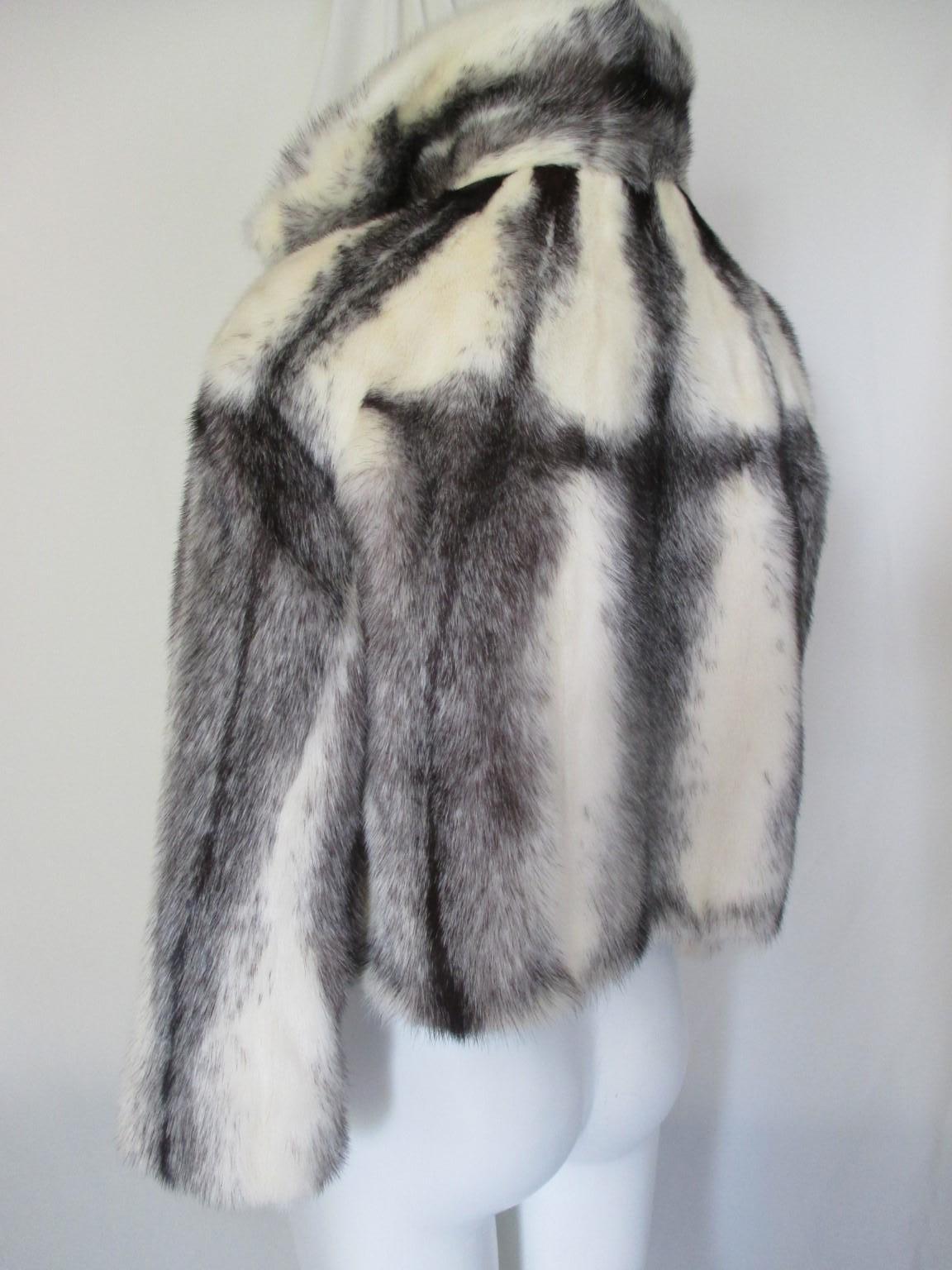 This vintage jacket/bolero look is made of rare soft kohinoor/cross mink fur with a beautiful black/silver striped lining which can be worn reversible.

Look at our storefront for more Kohinoor mink coats and other vintage fur items.

Details:
With
