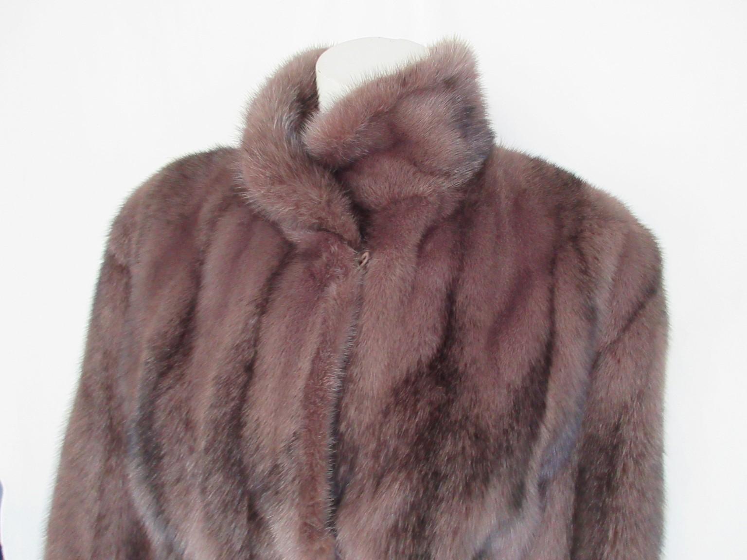 This coat is made of rare kohinoor/cross mink fur dyed in mauve/dusty pink Fendi style color

View our storefront for more fur coats and other vintage items.

Details:
Color: Dusty pink, luxurious fur coat designed with black blending.
Pristine