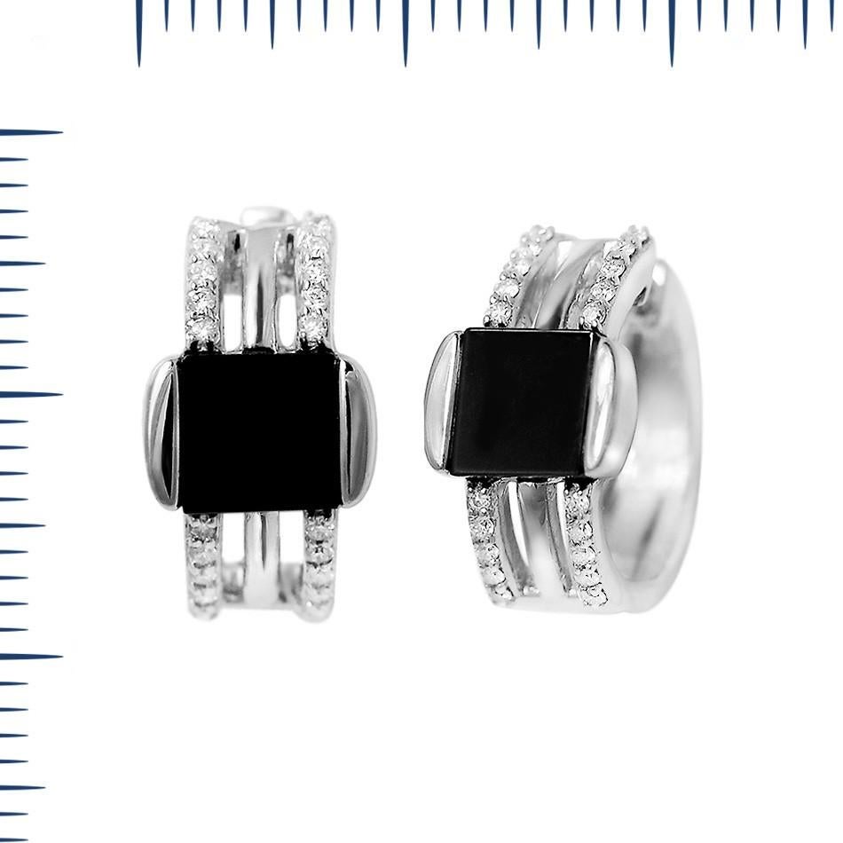 Earrings White Gold 14 K (Matching Ring Available)

Diamond 40-RND-0,24-G/SI1A
Onyx 2-1,87ct

Weight 6.8 grams

With a heritage of ancient fine Swiss jewelry traditions, NATKINA is a Geneva based jewellery brand, which creates modern jewellery
