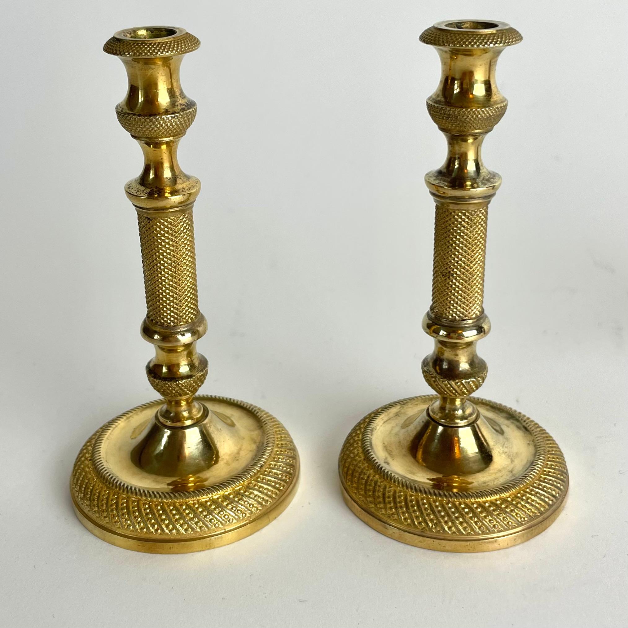 
Exclusive Pair of Miniature Gilt Bronze Candlesticks – Empire, France c. 1820

An exquisite pair of miniature gilt bronze candlesticks from the French Empire period, circa 1820. These elegant and well-preserved candlesticks are intricately crafted