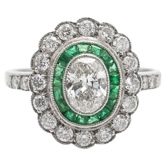 Exclusive platinum ring with 1.00ct diamonds and emeralds, mid-20th century.
