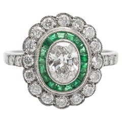 Exclusive platinum ring with 1.00ct diamonds and emeralds, mid-20th century.