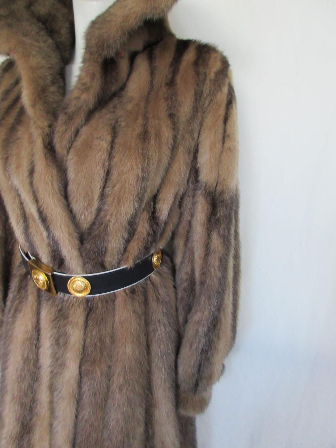 This coat is made of rare kohinoor/cross Saga mink fur dyed in a special color

View our storefront for more fur coats and other vintage items.

Details:
Saga furs are made from high quaility  mink
Huge collar
With 2 pockets, 2 closing hooks and
 2