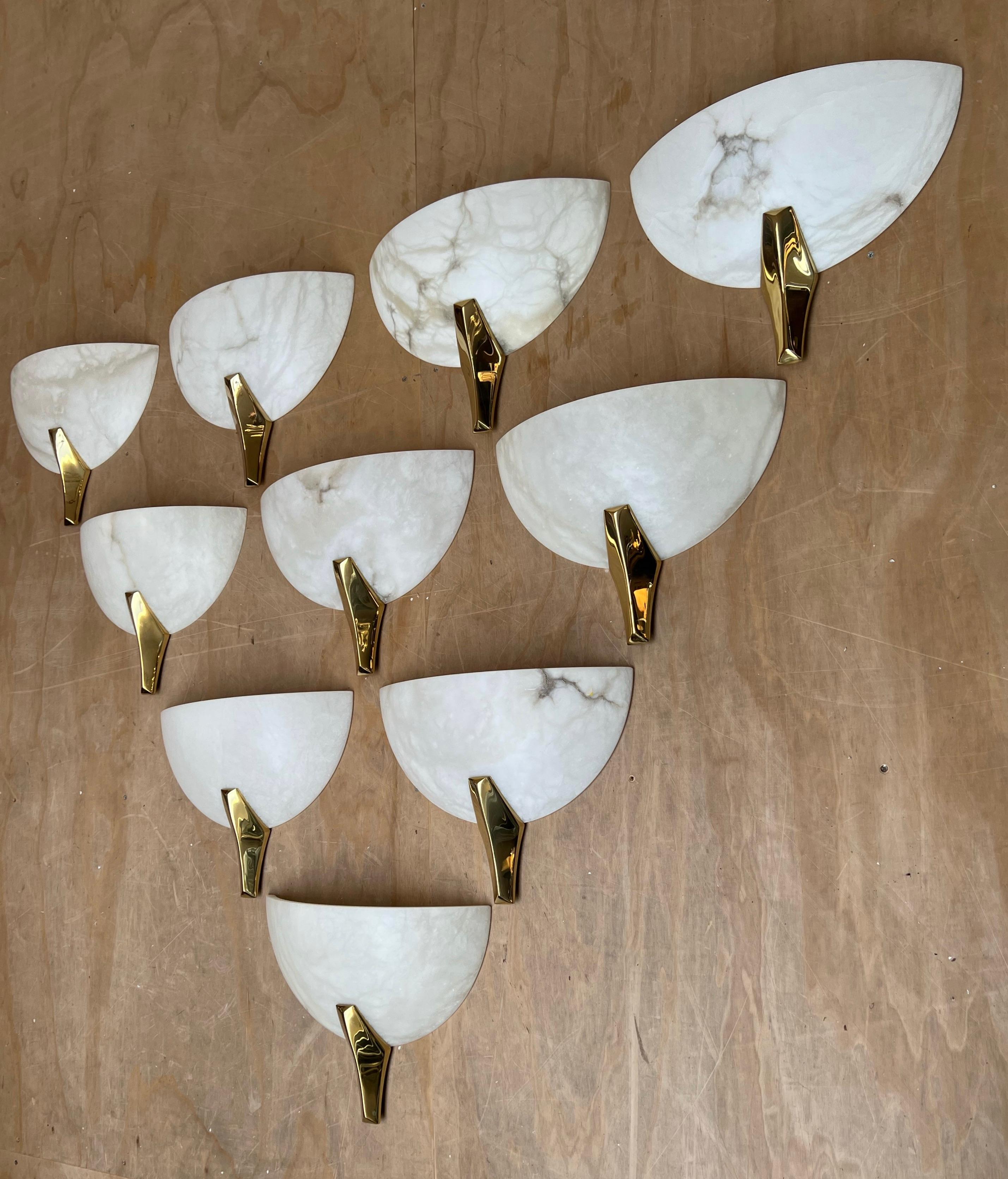 Ideal collection of 10 large alabaster wall lamps for a project.

Because of their timeless designs and warm light creating qualities, we have owned and sold many alabaster light fixtures. There is something about the look and feel of these