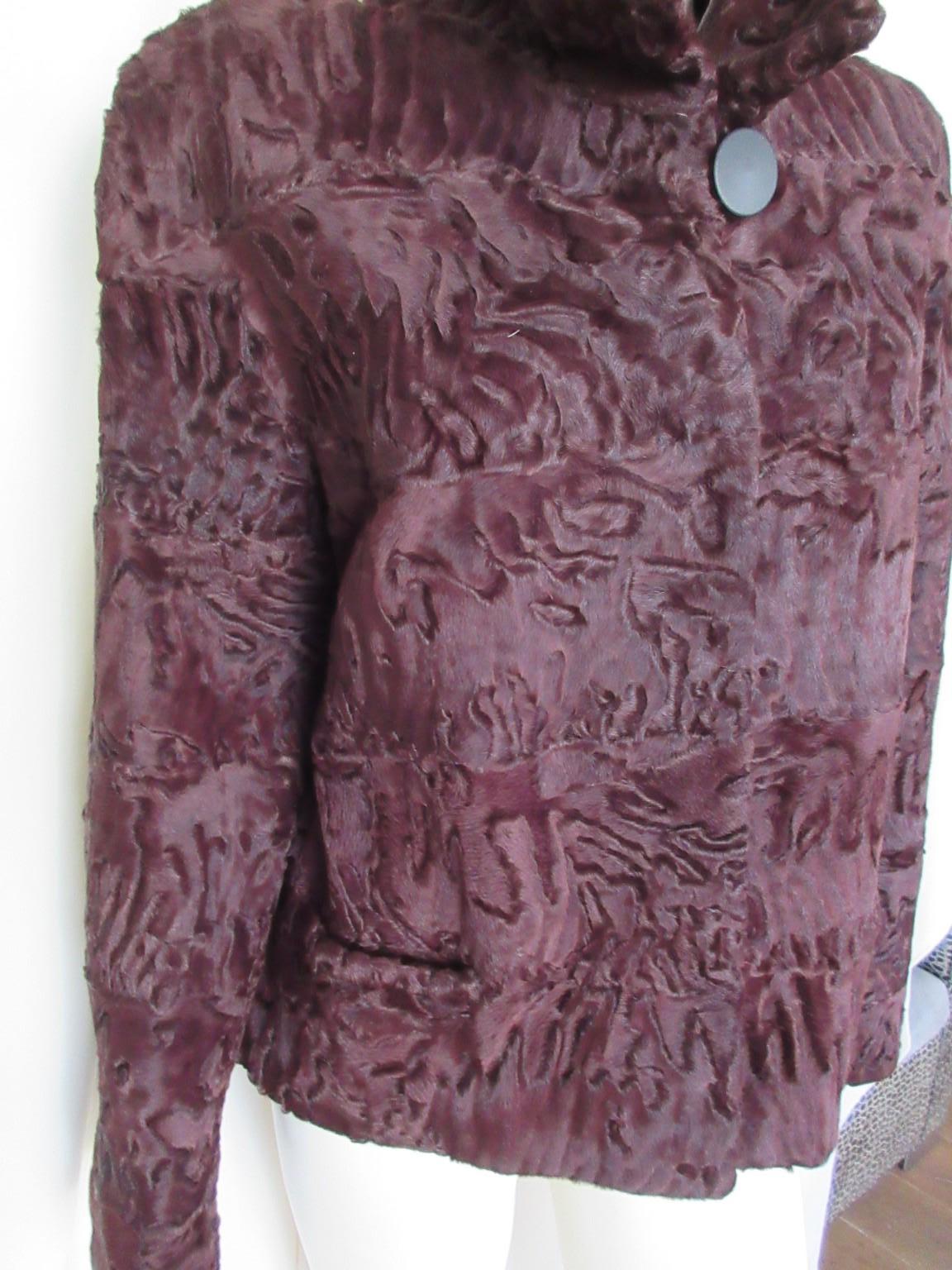 This exclusive short model is made of naturel Swakara lamb fur which is rare to find.

We offer more luxury fur and exclusive vintage items, view our frontstore.

Details:
Color: dyed bordeaux/red
With 2 pockets, 1 collar button
3 closing hooks
1