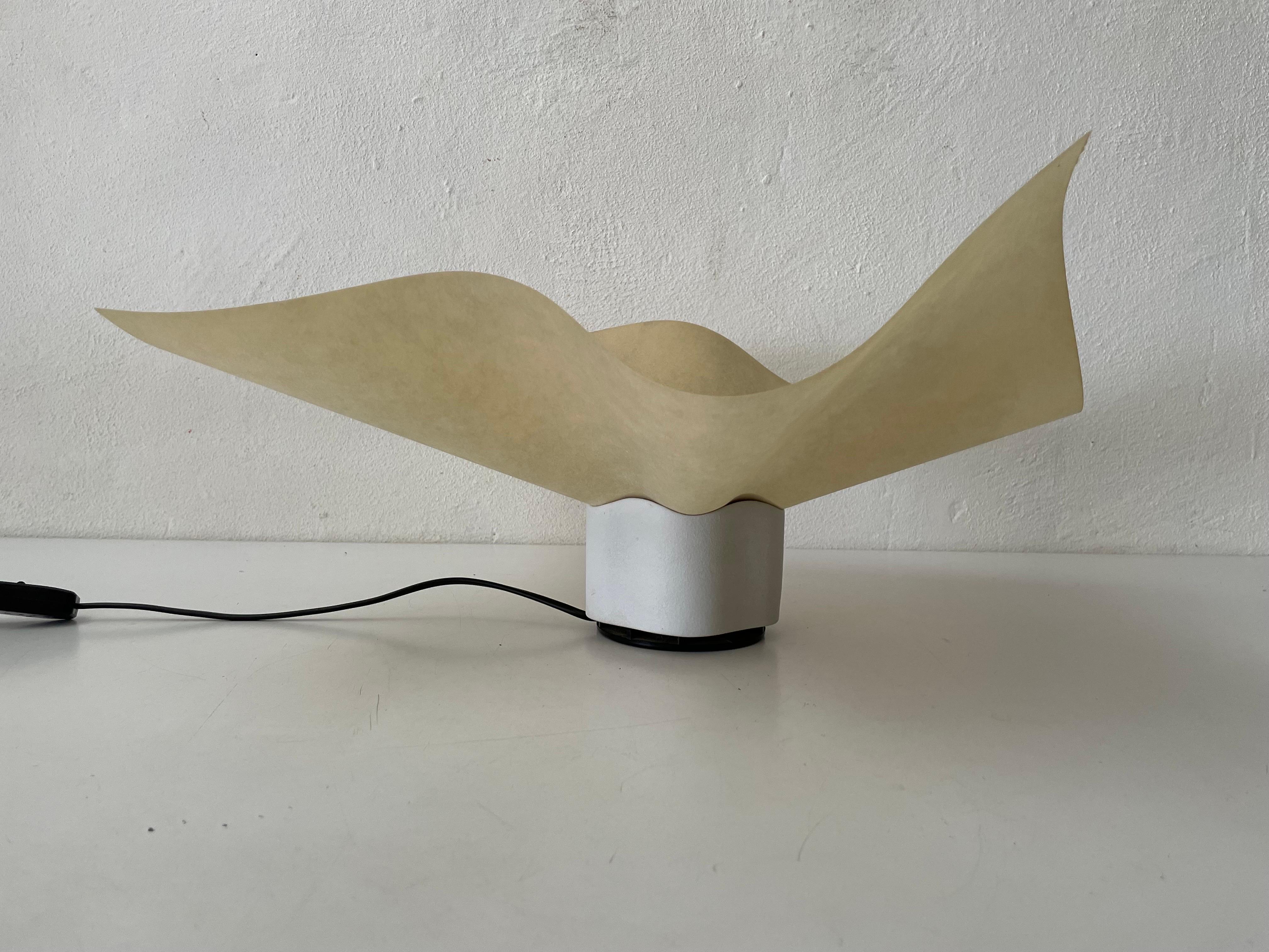 Exclusive Table Lamp by Mario Bellini for Artemide, 1970s, Italy

Lampshade is in good condition and very clean. 
This lamp works with E27 light bulb
Wired and suitable to use with 220V and 110V for all countries.

Measures: 
60 cm x 60 cm x 25