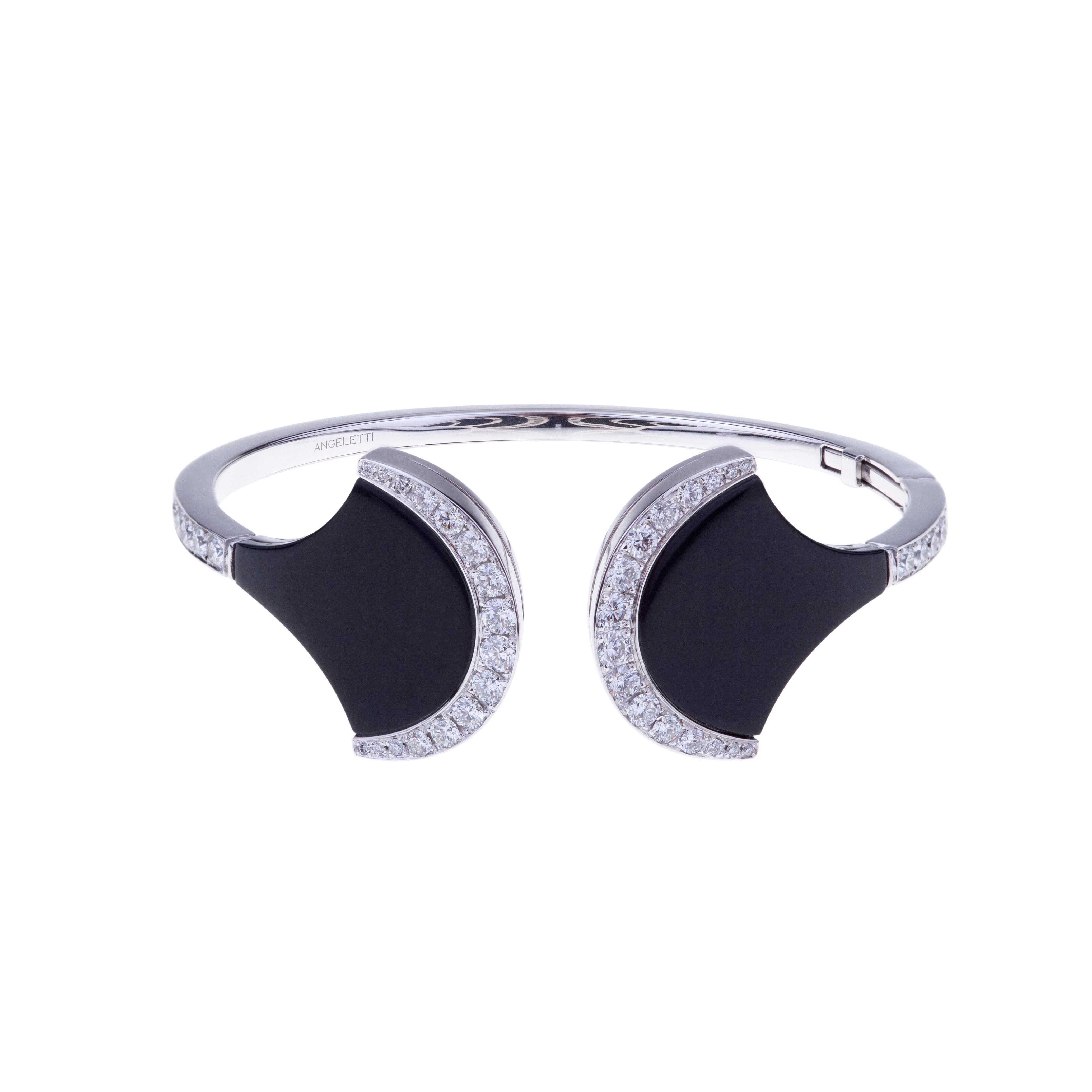 Exclusive Wave Bangle White Gold with Black Ceramic and Diamonds.
Everyday Fashionable Bangle with Glossy Ceramic and Diamond ct. 1.94 G-SI. 18kt Gold is around  15 grams. 
Angeletti Boasts an Exceptional History Made of Pure Jewelry Tradition, a