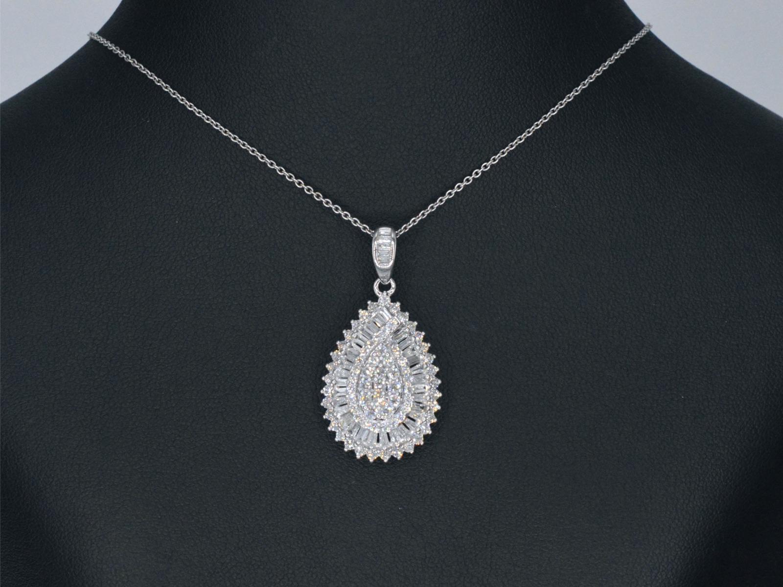 Diamonds: 108 pieces

Weight: 2.00 carats

Cut: Brilliant cut and Baguette cut

Colour: F-G

Clarity: SI

Quality: Very good

Jewel: Pendant (excl. necklace)

Weight: 5.5 gram

Hallmark: 14 karat 

Measurement: 18 x 33 cm

Condition: New

Retail