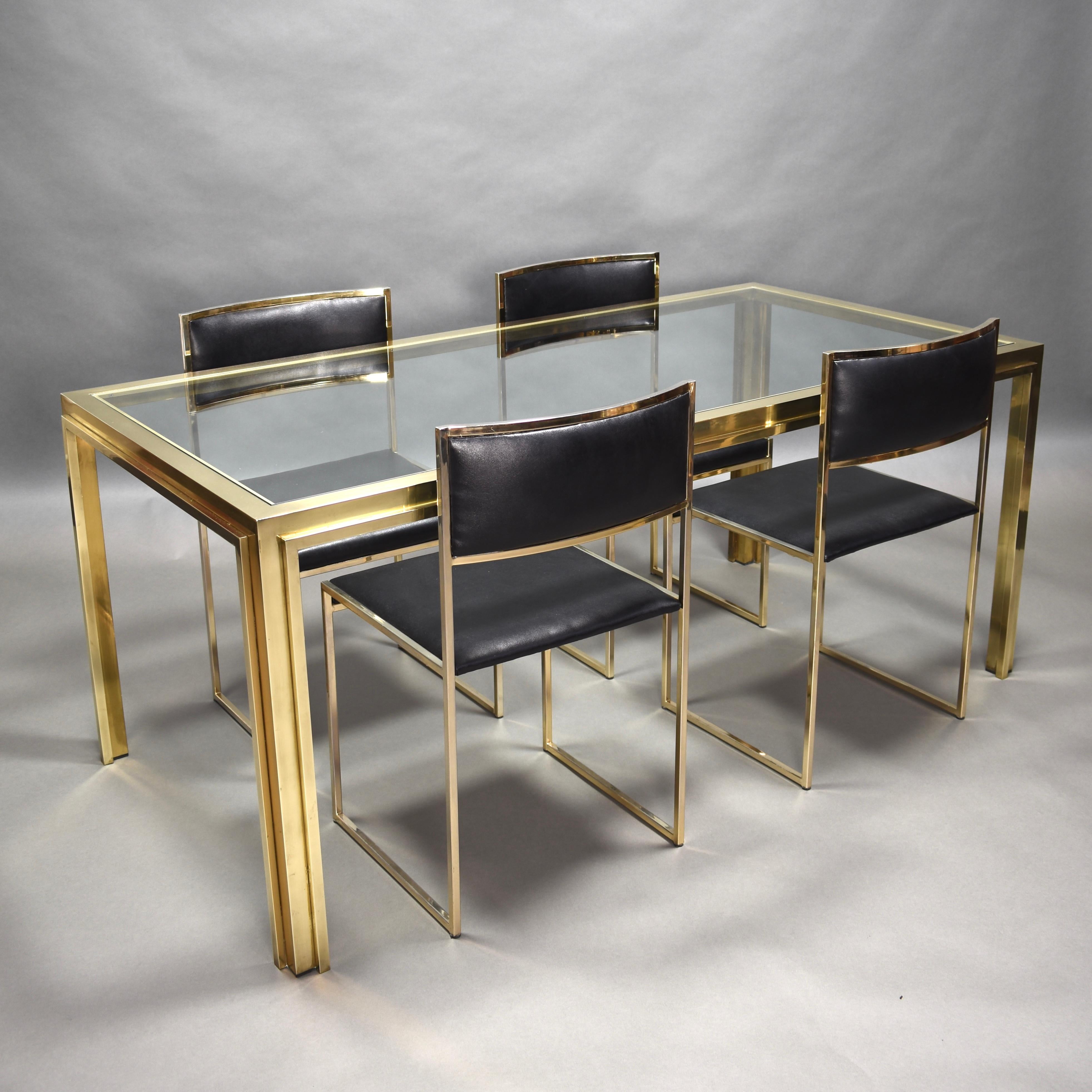 Exclusive and rare set of four 24-karat gold-plated dining chairs by Willy Rizzo, Italy, circa 1970. 
The table is made of solid brass and clear glass and was designed by an unknown designer, but the chairs and table match very well