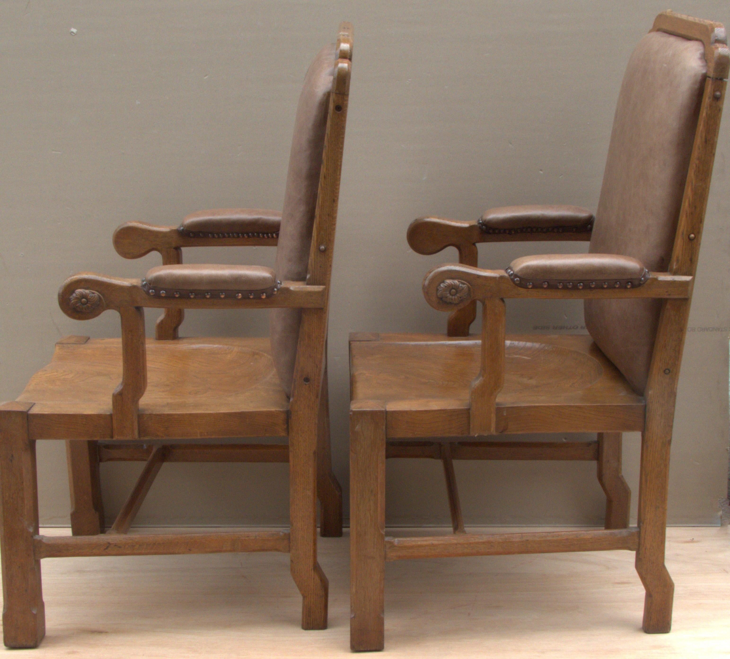 A god pair of executive Arm Chairs made in solid oak, most comfortable with leather padded back and arm rests.