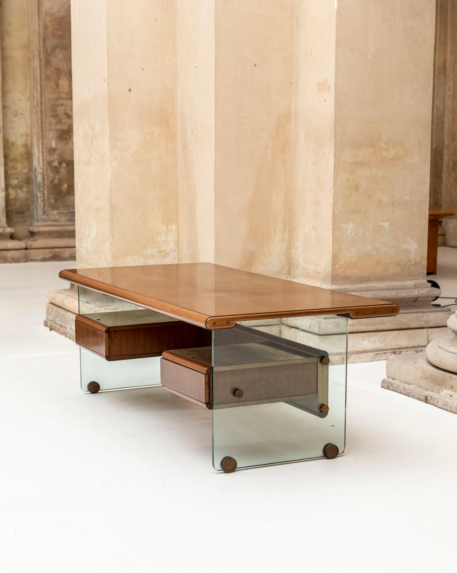 Stunning wood and glass executive desk attributed to Fabio Lenci for Comfort Line.
Two large drawers and elegant brass details hold the glass.
  