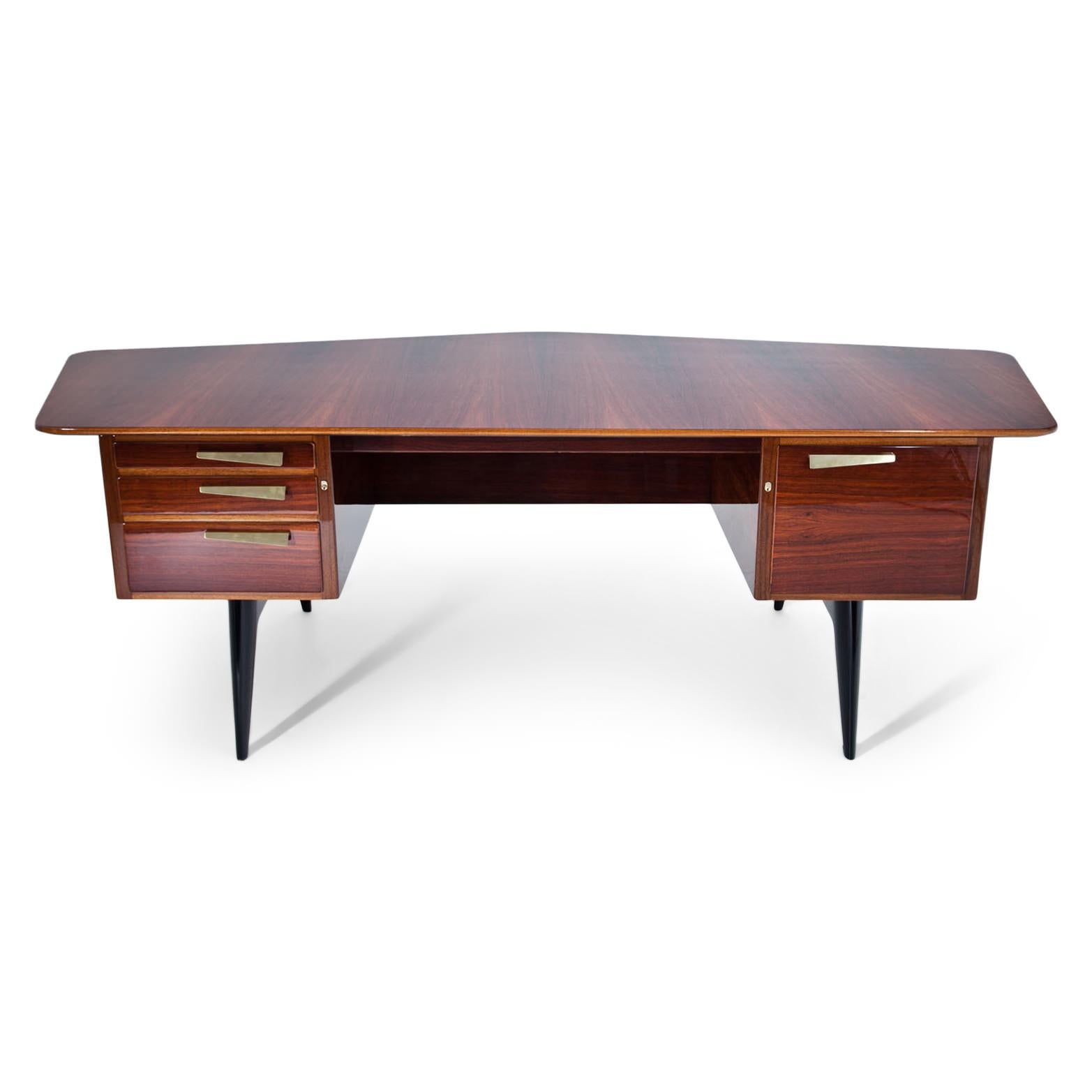 Scandinavian desk on black tapered legs, with four lockable drawers and a pentagonal large tabletop. The desk was designed for an all-round view. The desk is hand-polished and professionally refurbished. Label inside the second drawer.